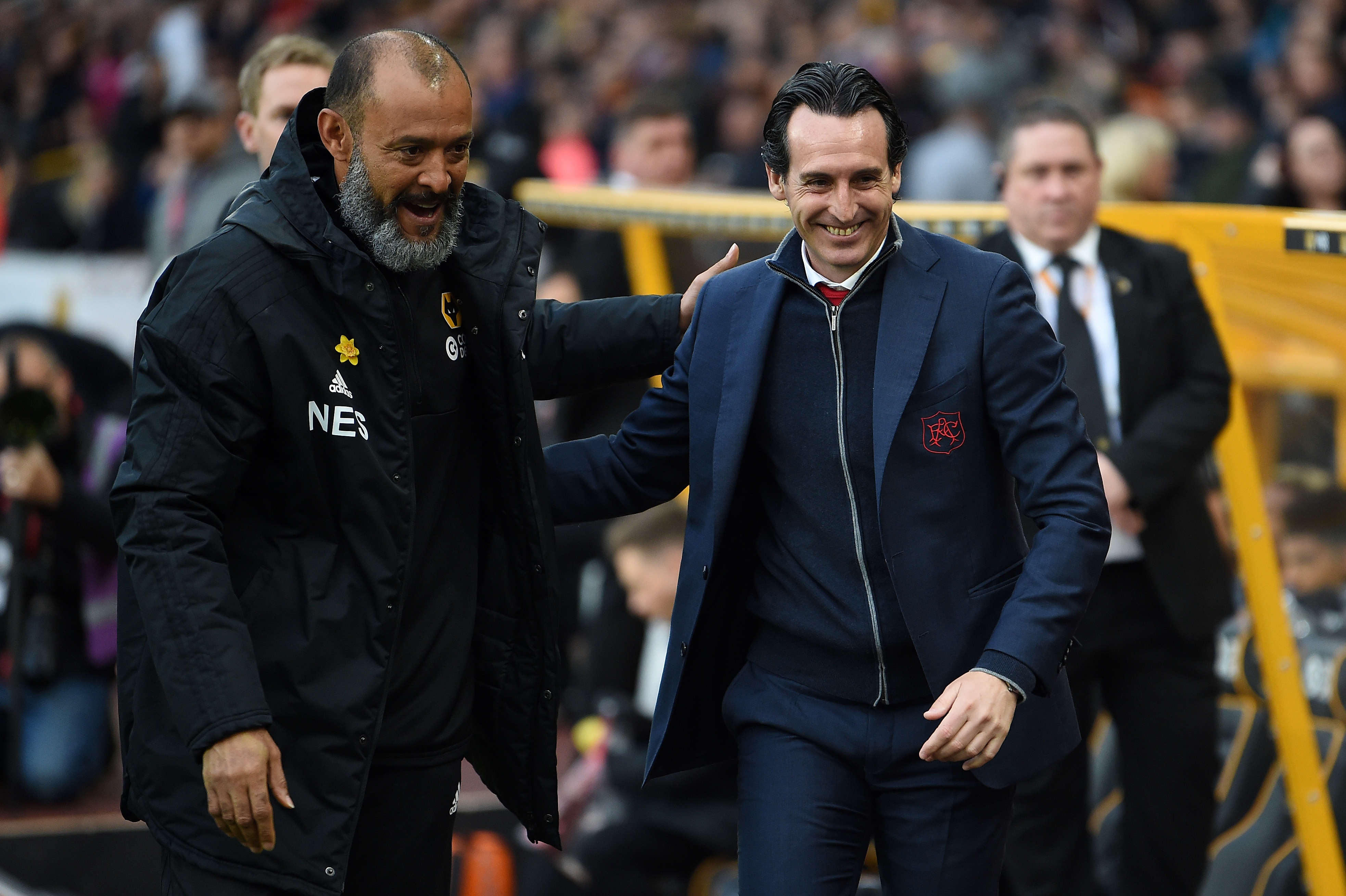 Arsenal's Spanish head coach Unai Emery (R) is greeted by Wolverhampton Wanderers' Portuguese head coach Nuno Espirito Santo ahead of the English Premier League football match between Wolverhampton Wanderers and Arsenal at the Molineux stadium in Wolverhampton, central England on April 24, 2019. (Photo by PAUL ELLIS / AFP) / RESTRICTED TO EDITORIAL USE. No use with unauthorized audio, video, data, fixture lists, club/league logos or 'live' services. Online in-match use limited to 120 images. An additional 40 images may be used in extra time. No video emulation. Social media in-match use limited to 120 images. An additional 40 images may be used in extra time. No use in betting publications, games or single club/league/player publications. /         (Photo credit should read PAUL ELLIS/AFP via Getty Images)