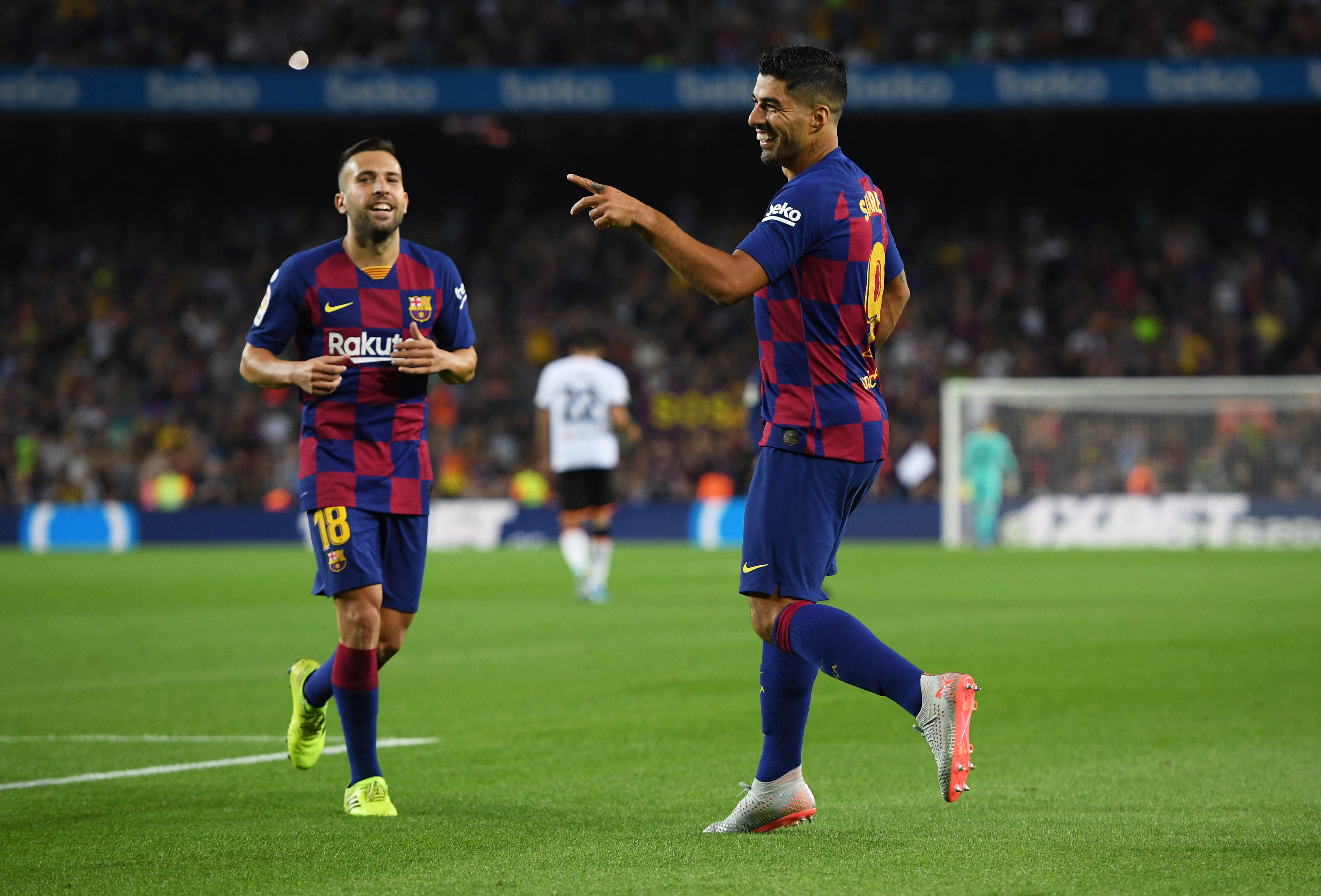 BARCELONA, SPAIN - SEPTEMBER 14:  Luis Suarez of FC Barcelona celebrates as he scores his team's fifth goal with Jordi Alba during the Liga match between FC Barcelona and Valencia CF at Camp Nou on September 14, 2019 in Barcelona, Spain. (Photo by Alex Caparros/Getty Images)