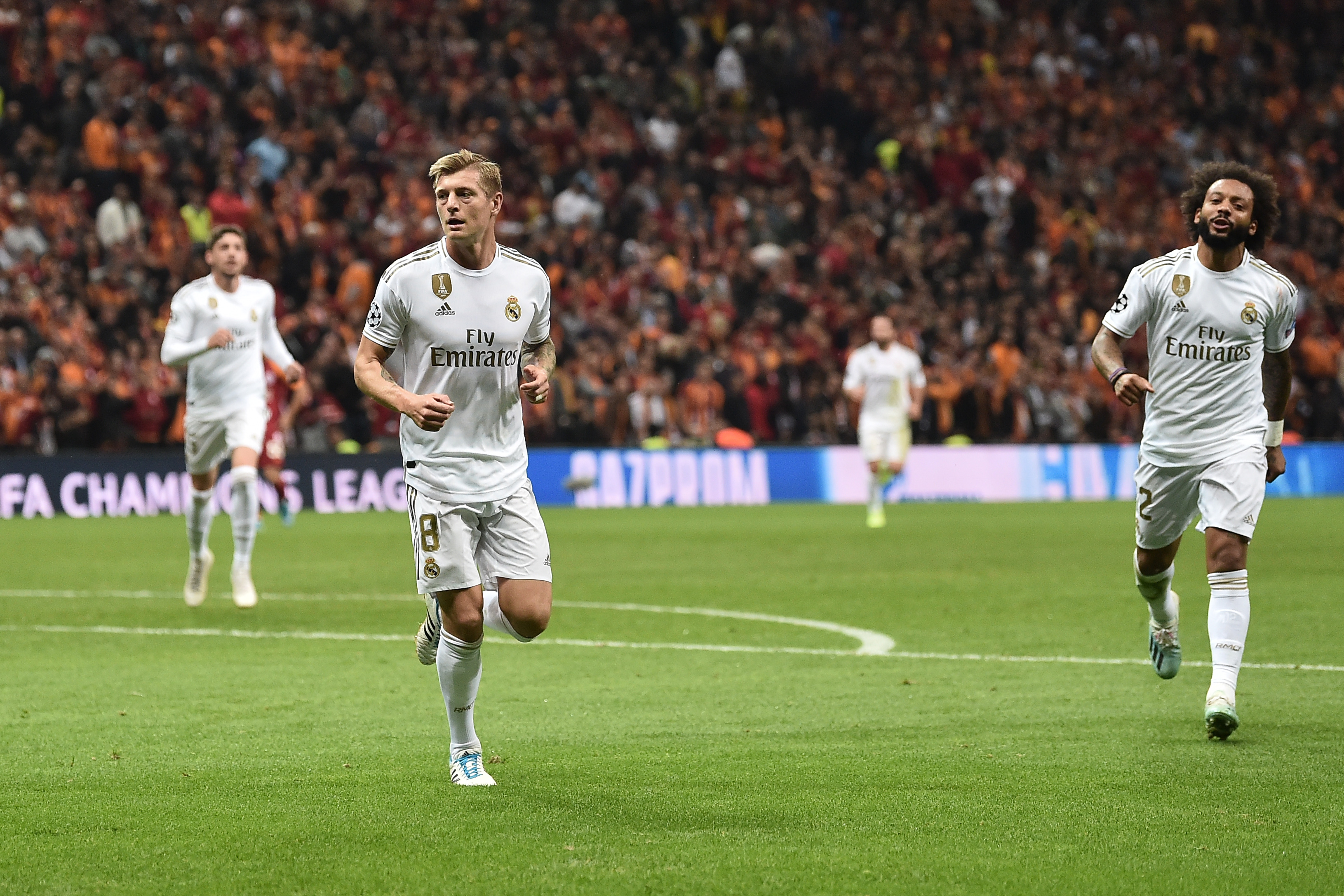 Real Madrid's German midfielder Toni Kroos (L) celebrates with Real Madrid's Brazilian defender Marcelo (R) after he scored a goal during the UEFA Champions League group A football match between Galatasaray and Real Madrid on October 22, 2019 at the Ali Sami Yen Spor Kompleksi in Istanbul. (Photo by OZAN KOSE / AFP) (Photo by OZAN KOSE/AFP via Getty Images)
