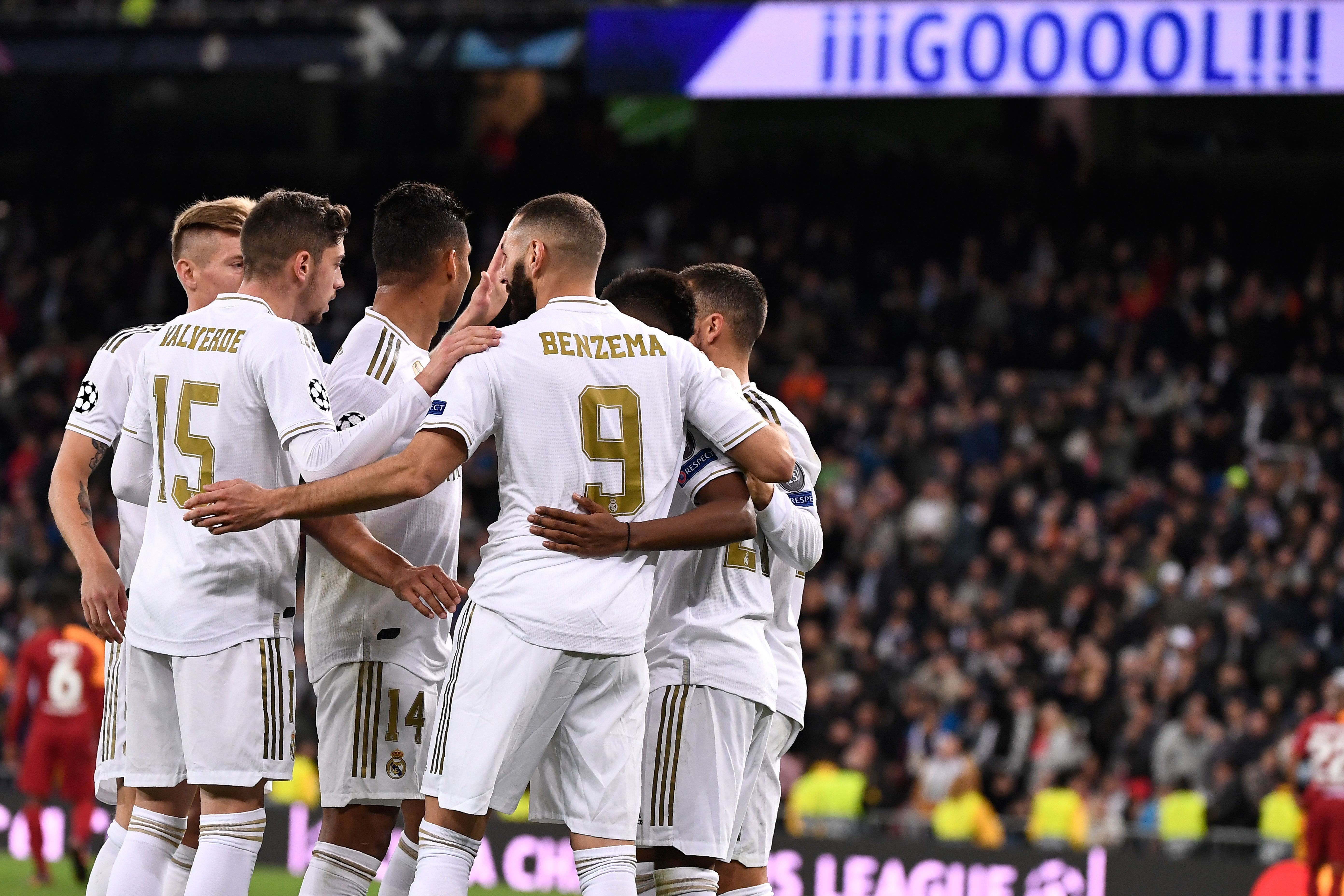 Real Madrid's French forward Karim Benzema (C) celebrates with teammates after scoring during the UEFA Champions League Group A football match between Real Madrid and Galatasaray at the Santiago Bernabeu stadium in Madrid, on November 6, 2019. (Photo by PIERRE-PHILIPPE MARCOU / AFP) (Photo by PIERRE-PHILIPPE MARCOU/AFP via Getty Images)