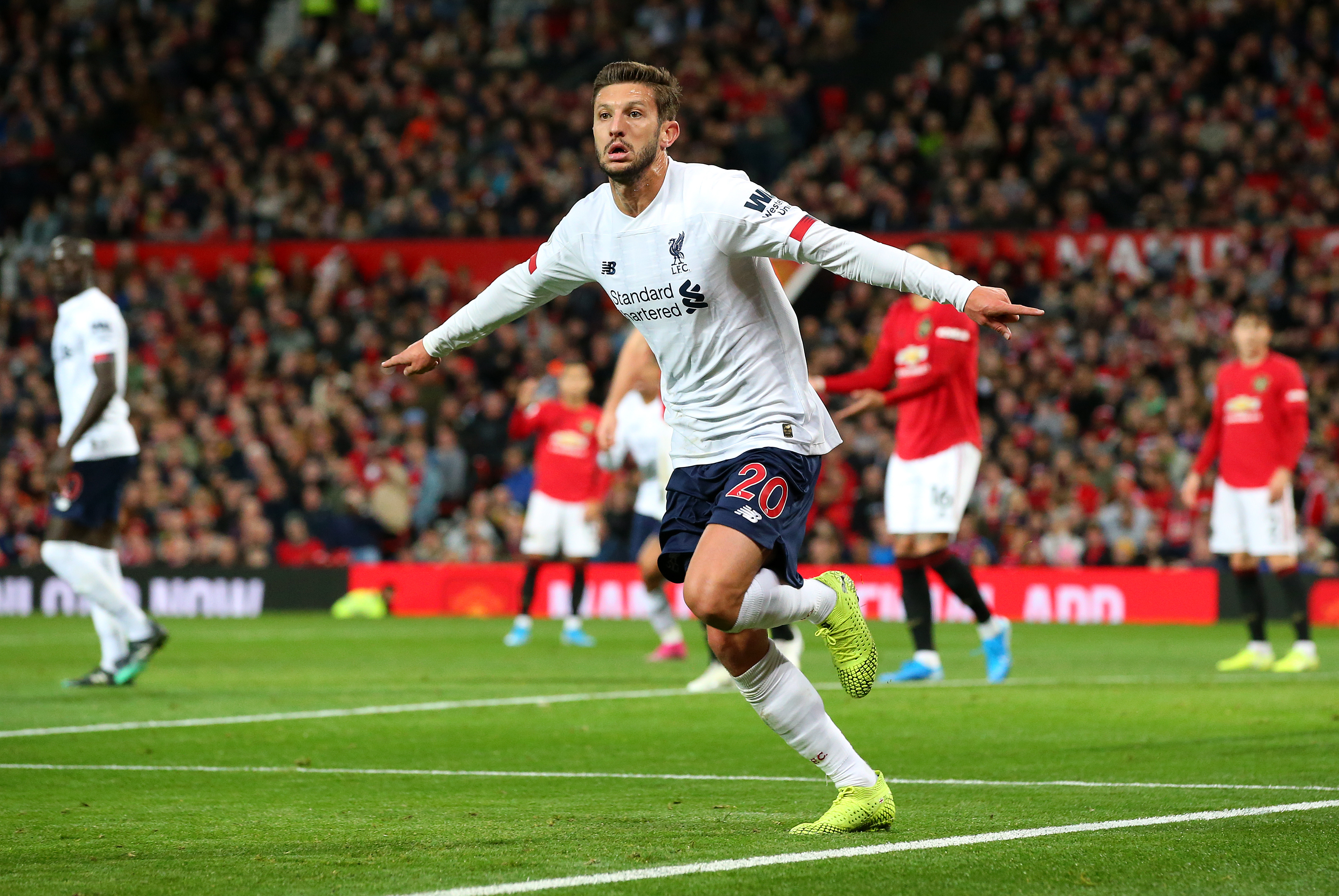 MANCHESTER, ENGLAND - OCTOBER 20:  Adam Lallana of Liverpool celebrates after scoring his sides first goal during the Premier League match between Manchester United and Liverpool FC at Old Trafford on October 20, 2019 in Manchester, United Kingdom. (Photo by Alex Livesey/Getty Images)