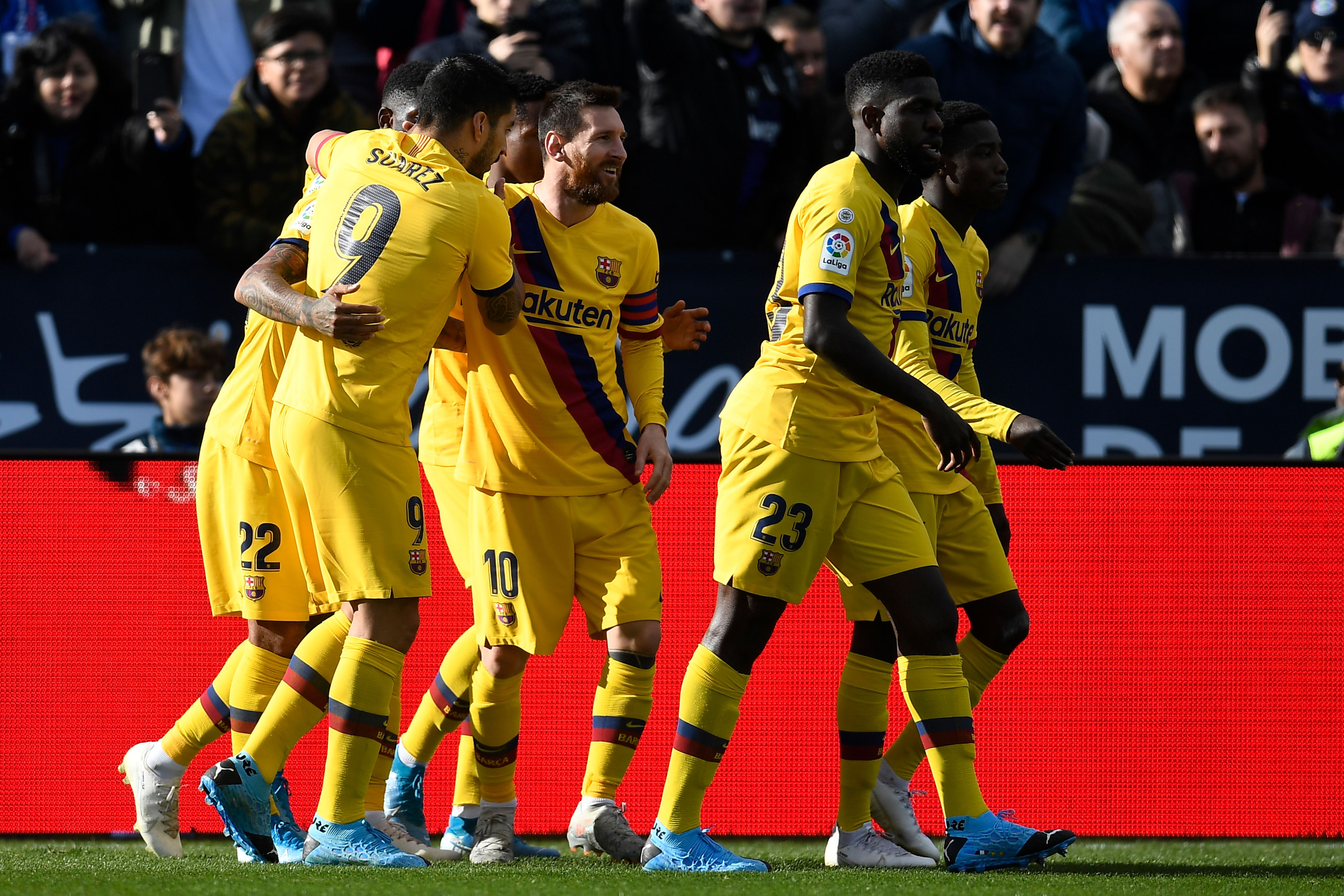 Barcelona's players celebrate after Chilean midfielder Arturo Vidal scored during the Spanish league football match Club Deportivo Leganes SAD against FC Barcelona at the Estadio Municipal Butarque in Leganes on November 23, 2019. (Photo by PIERRE-PHILIPPE MARCOU / AFP) (Photo by PIERRE-PHILIPPE MARCOU/AFP via Getty Images)