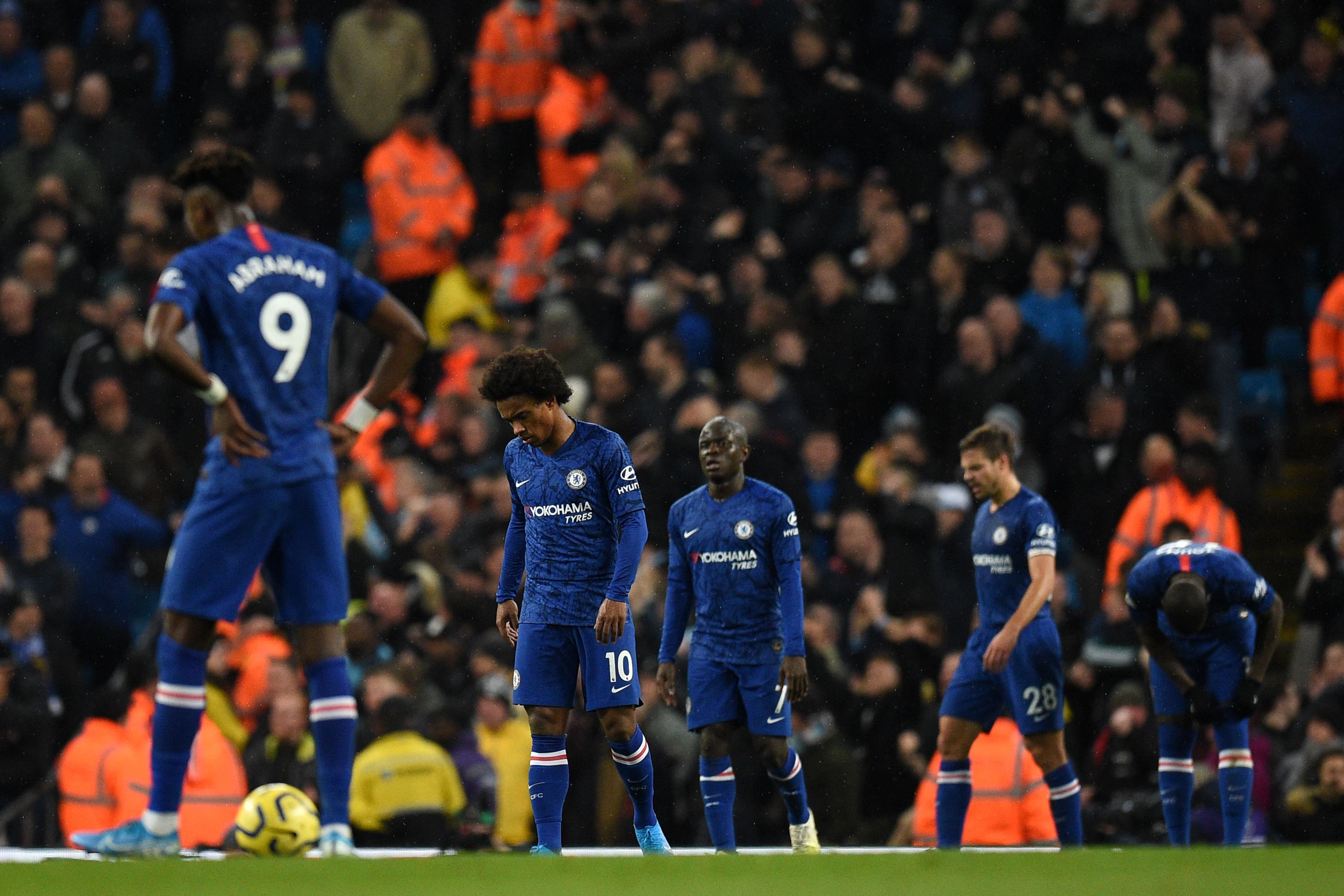 Chelsea players react to conceding their second goal during the English Premier League football match between Manchester City and Chelsea at the Etihad Stadium in Manchester, north west England, on November 23, 2019. (Photo by Oli SCARFF / AFP) / RESTRICTED TO EDITORIAL USE. No use with unauthorized audio, video, data, fixture lists, club/league logos or 'live' services. Online in-match use limited to 120 images. An additional 40 images may be used in extra time. No video emulation. Social media in-match use limited to 120 images. An additional 40 images may be used in extra time. No use in betting publications, games or single club/league/player publications. /  (Photo by OLI SCARFF/AFP via Getty Images)