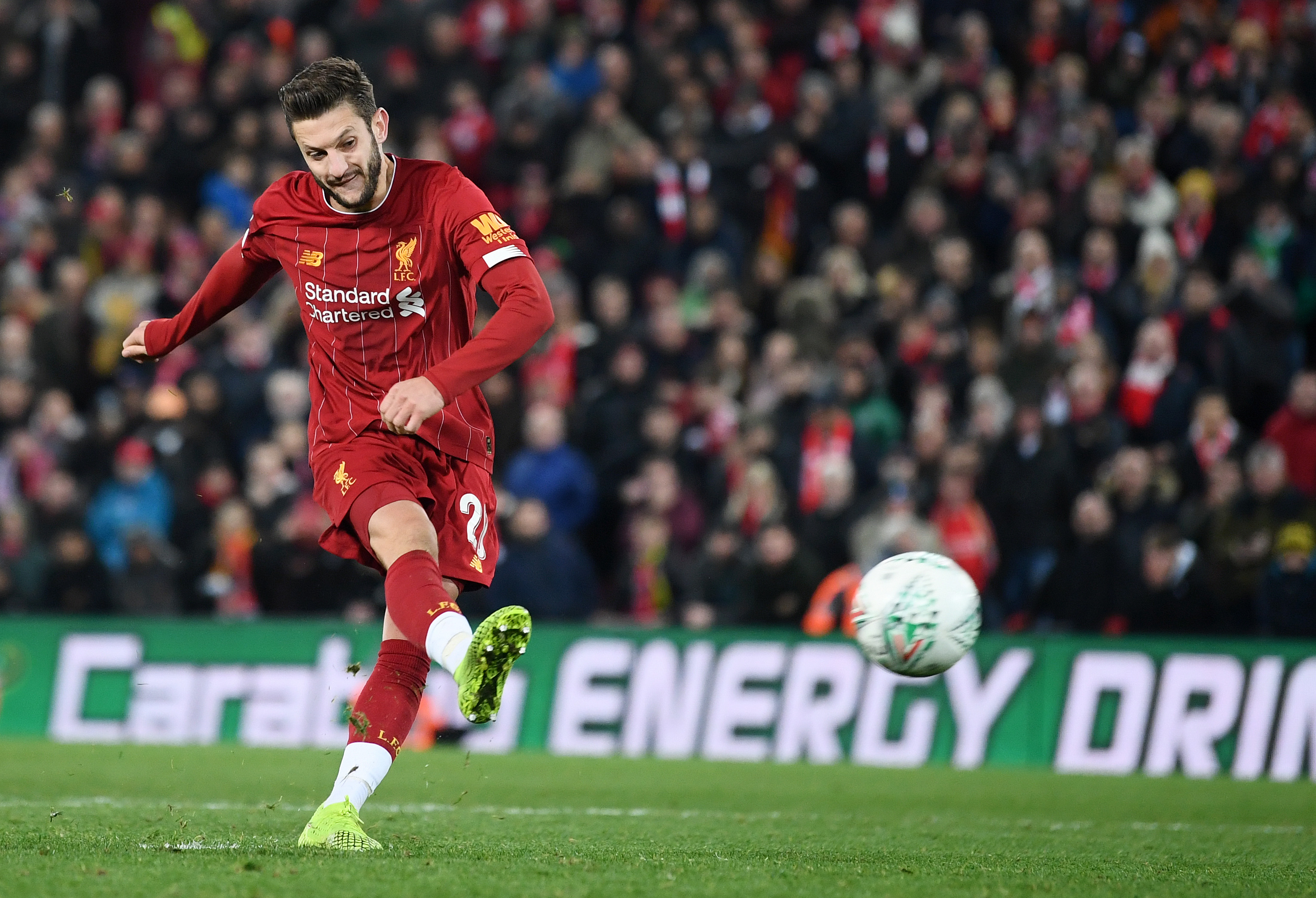 LIVERPOOL, ENGLAND - OCTOBER 30: Adam Lallana of Liverpool scores his sides second penalty during the penalty shoot out during the Carabao Cup Round of 16 match between Liverpool and Arsenal at Anfield on October 30, 2019 in Liverpool, England. (Photo by Laurence Griffiths/Getty Images)