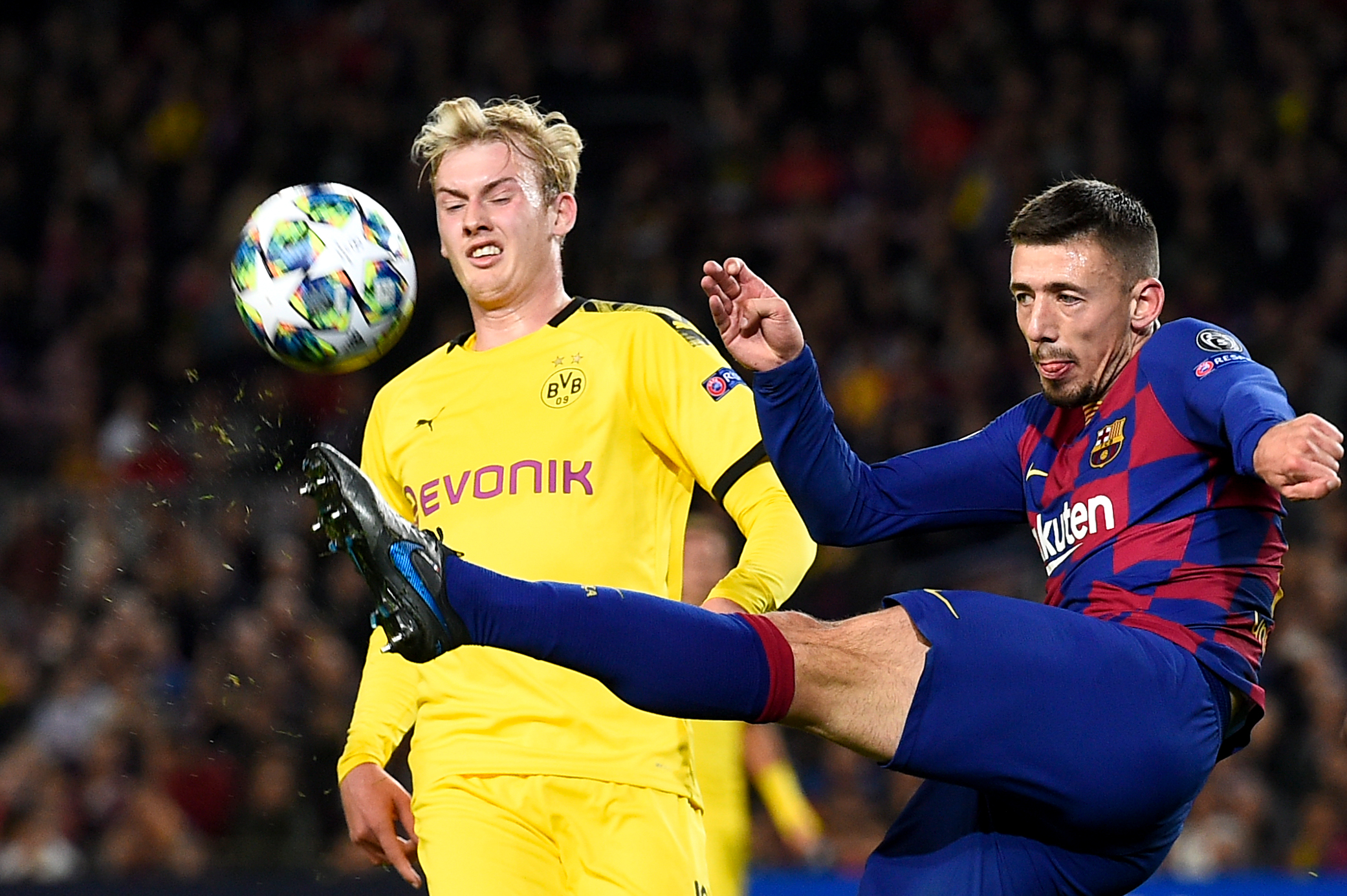 Barcelona's French defender Clement Lenglet (R) kicks the ball next to Dortmund's German forward Julian Brandt during the UEFA Champions League Group F football match between FC Barcelona and Borussia Dortmund at the Camp Nou stadium in Barcelona, on November 27, 2019. (Photo by Josep LAGO / AFP) (Photo by JOSEP LAGO/AFP via Getty Images)