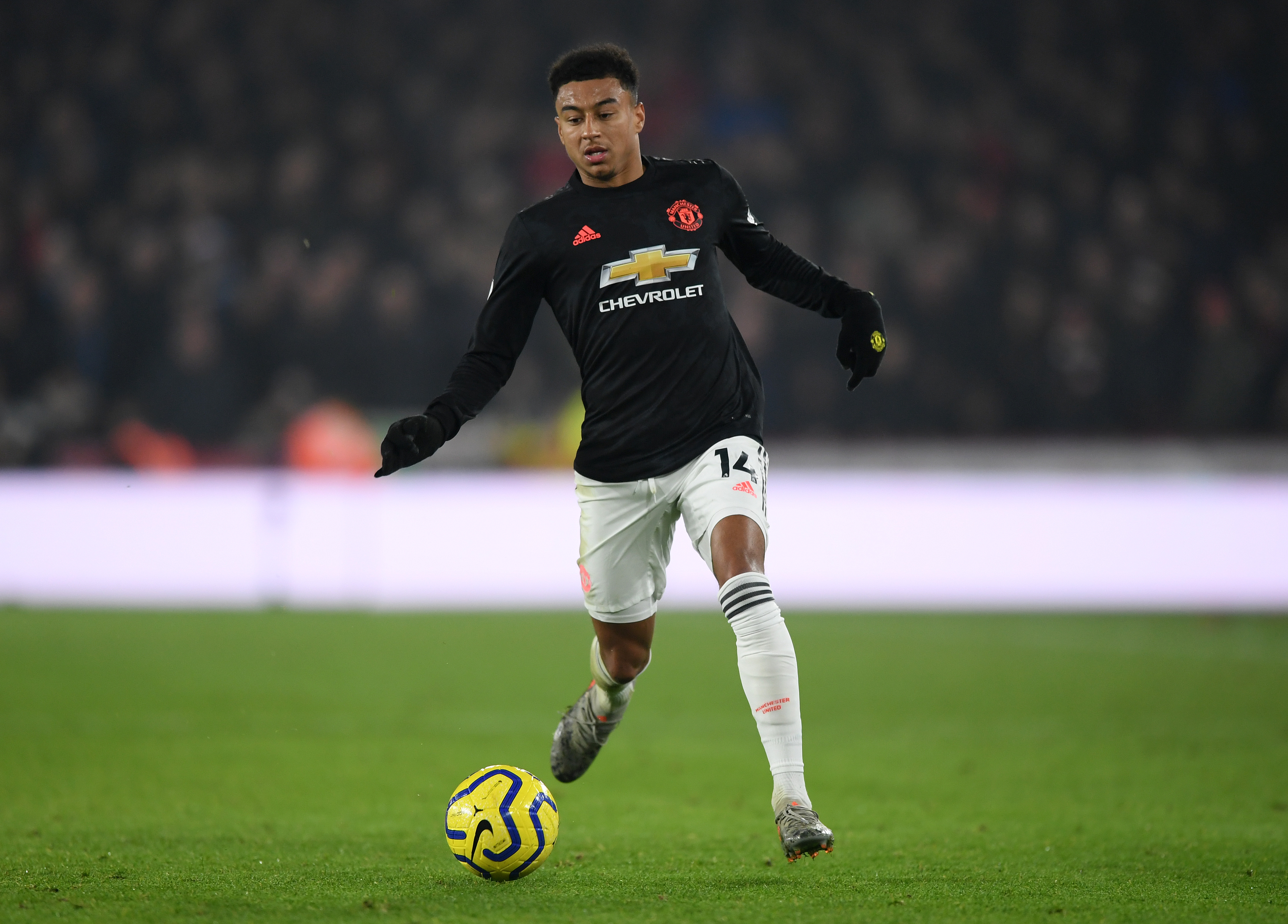 SHEFFIELD, ENGLAND - NOVEMBER 24:  Jesse Lingard of Manchester United runs with the ball during the Premier League match between Sheffield United and Manchester United at Bramall Lane on November 24, 2019 in Sheffield, United Kingdom. (Photo by Shaun Botterill/Getty Images)