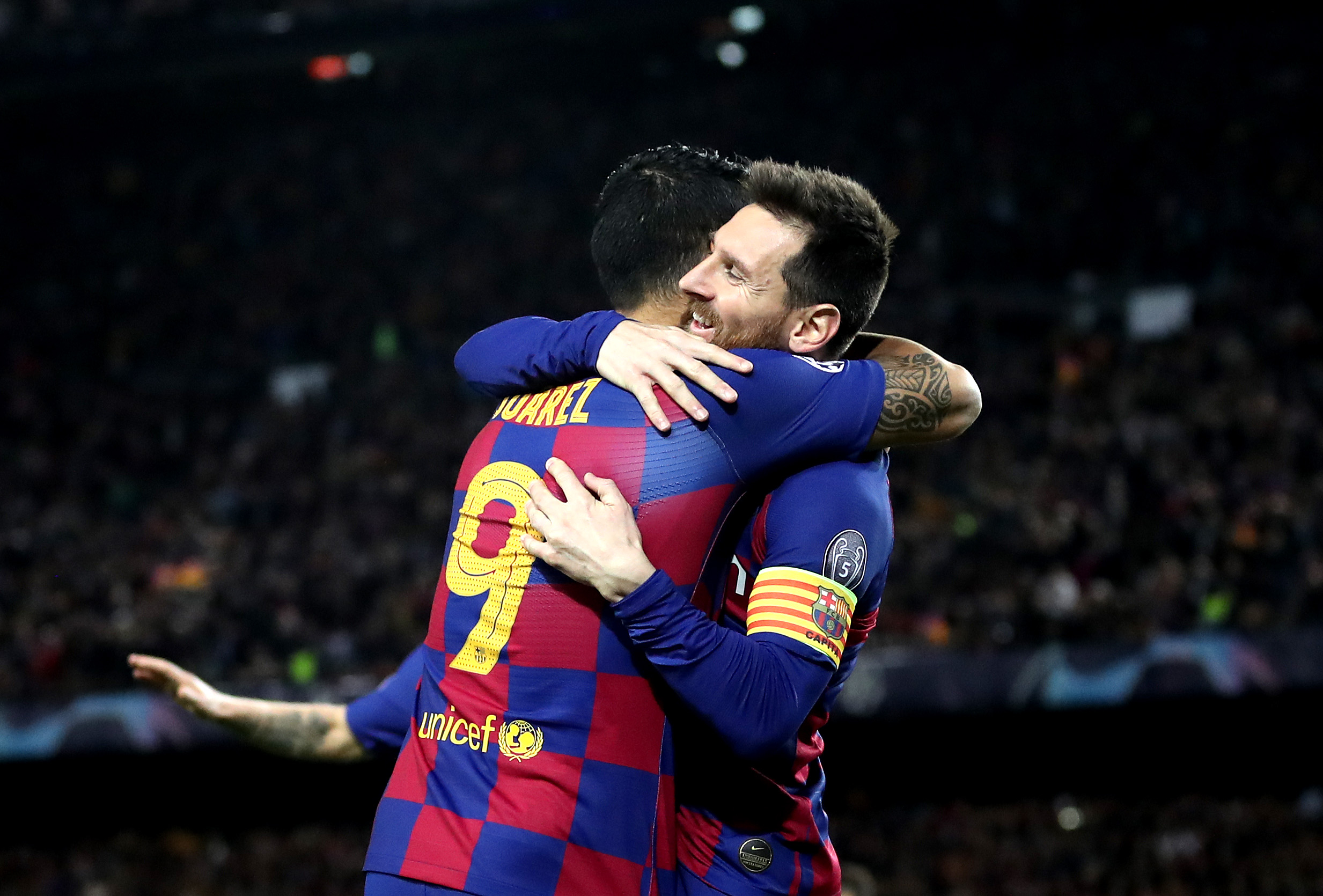 BARCELONA, SPAIN - NOVEMBER 27: Luis Suarez of FC Barcelona celebrates with teammate Lionel Messi after scoring his team's first goal during the UEFA Champions League group F match between FC Barcelona and Borussia Dortmund at Camp Nou on November 27, 2019 in Barcelona, Spain. (Photo by Maja Hitij/Bongarts/Getty Images)