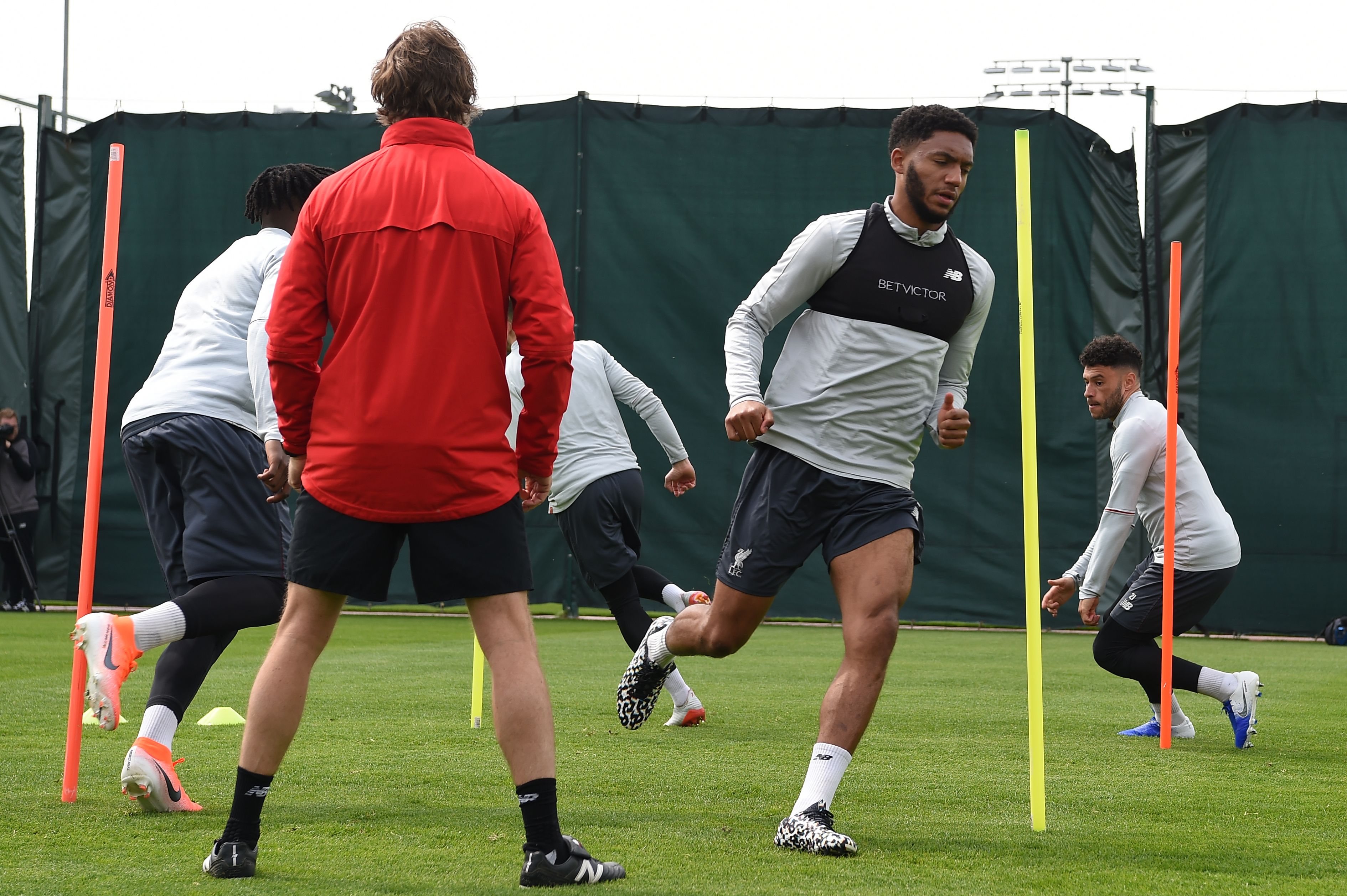 Liverpool's English defender Joe Gomez (2R) and Liverpool's English midfielder Alex Oxlade-Chamberlain (R) take part in a team training session at Melwood in Liverpool, north west England on April 30, 2019, on the eve of their UEFA Champions League semi-final first leg football match against Barcelona. (Photo by Paul ELLIS / AFP)        (Photo credit should read PAUL ELLIS/AFP via Getty Images)