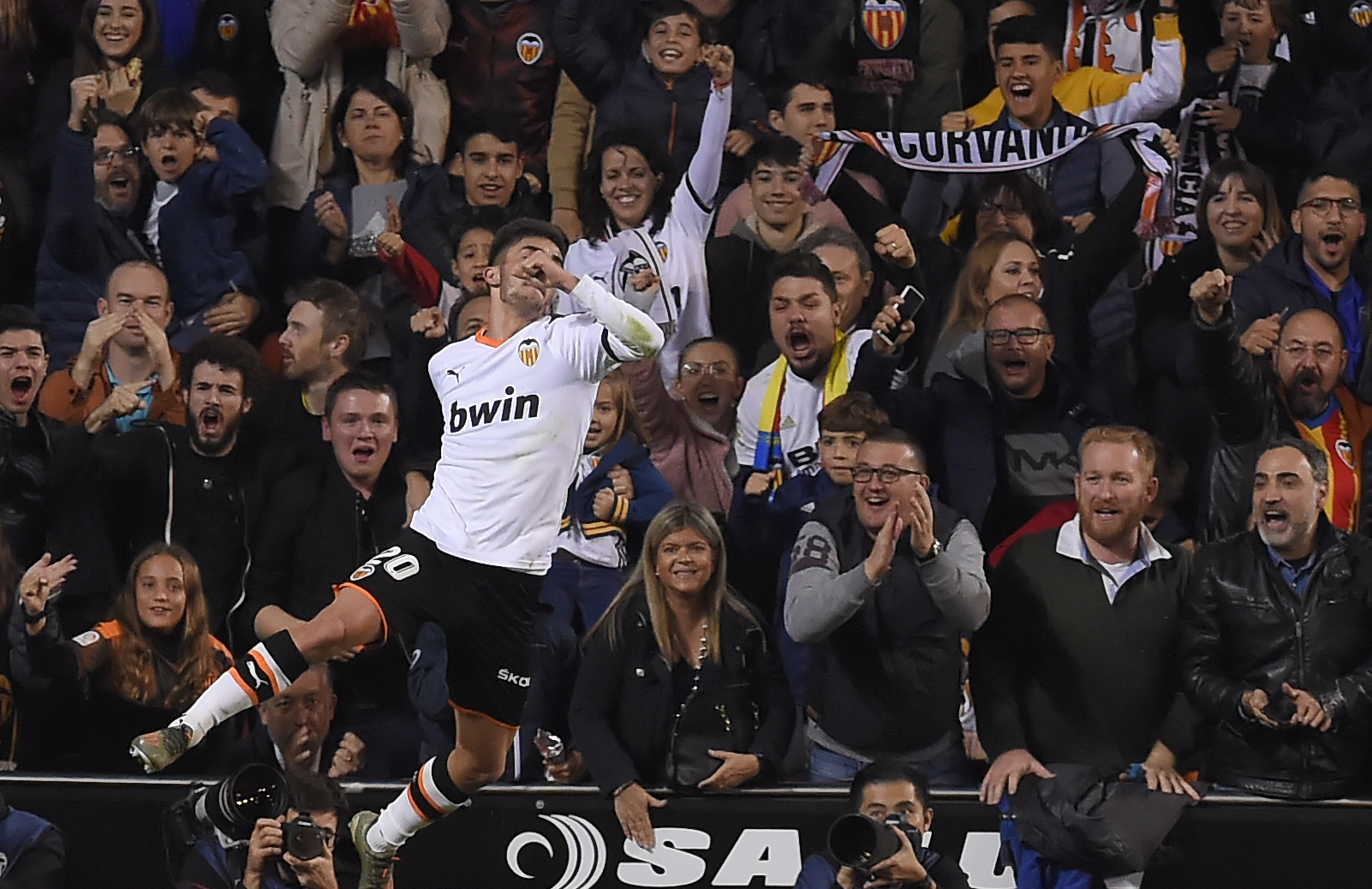 Valencia's Spanish midfielder Ferran Torres celebrates after scoring during the Spanish league football match between Valencia CF and Villarreal CF at the Mestalla stadium in Valencia on November 30, 2019. (Photo by JOSE JORDAN / AFP) (Photo by JOSE JORDAN/AFP via Getty Images)