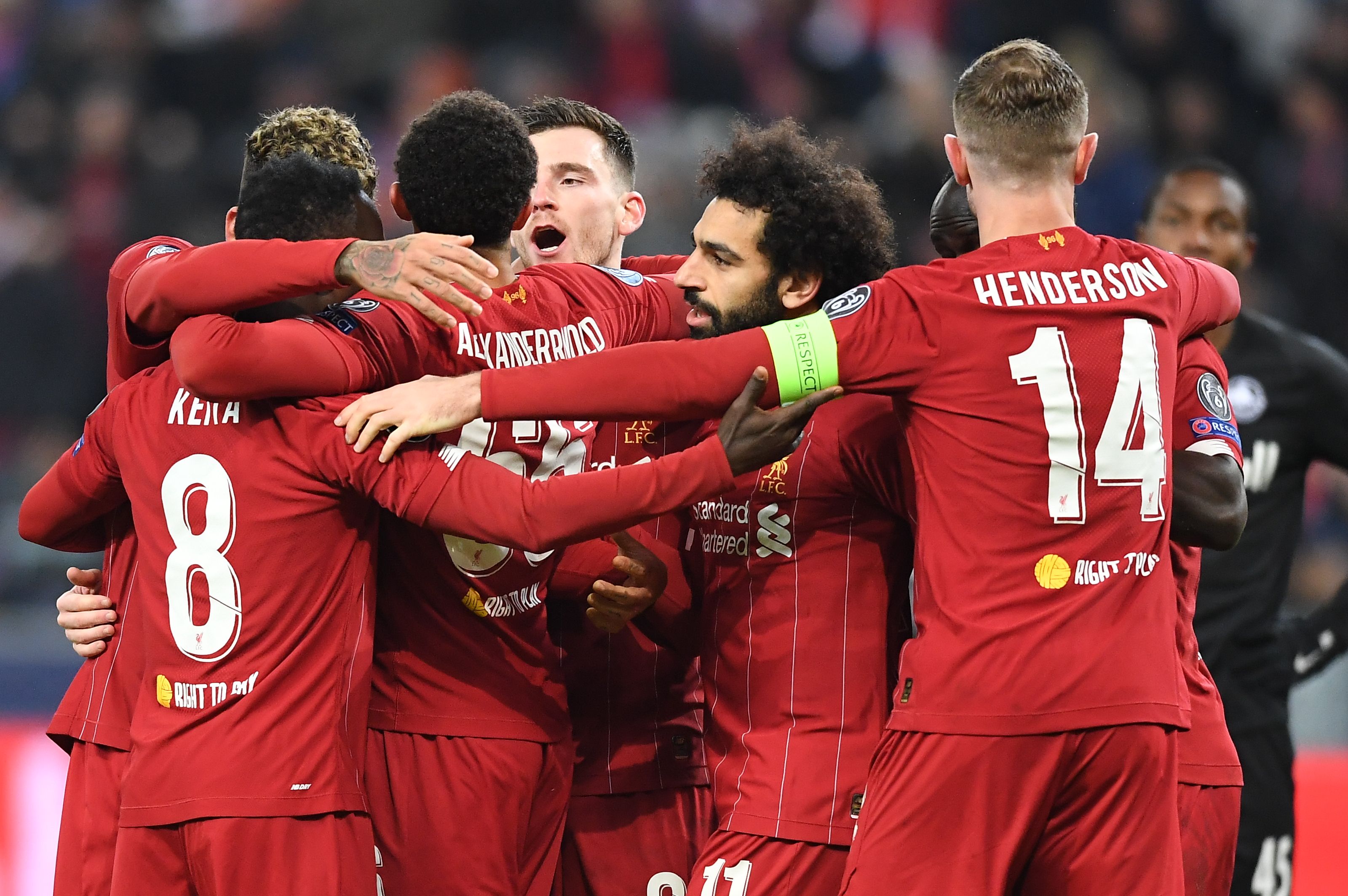 Liverpool's team celebrates after scoring during the UEFA Champions League Group E football match between RB Salzburg and Liverpool FC on December 10, 2019 in Salzburg, Austria. (Photo by JOE KLAMAR / AFP) (Photo by JOE KLAMAR/AFP via Getty Images)