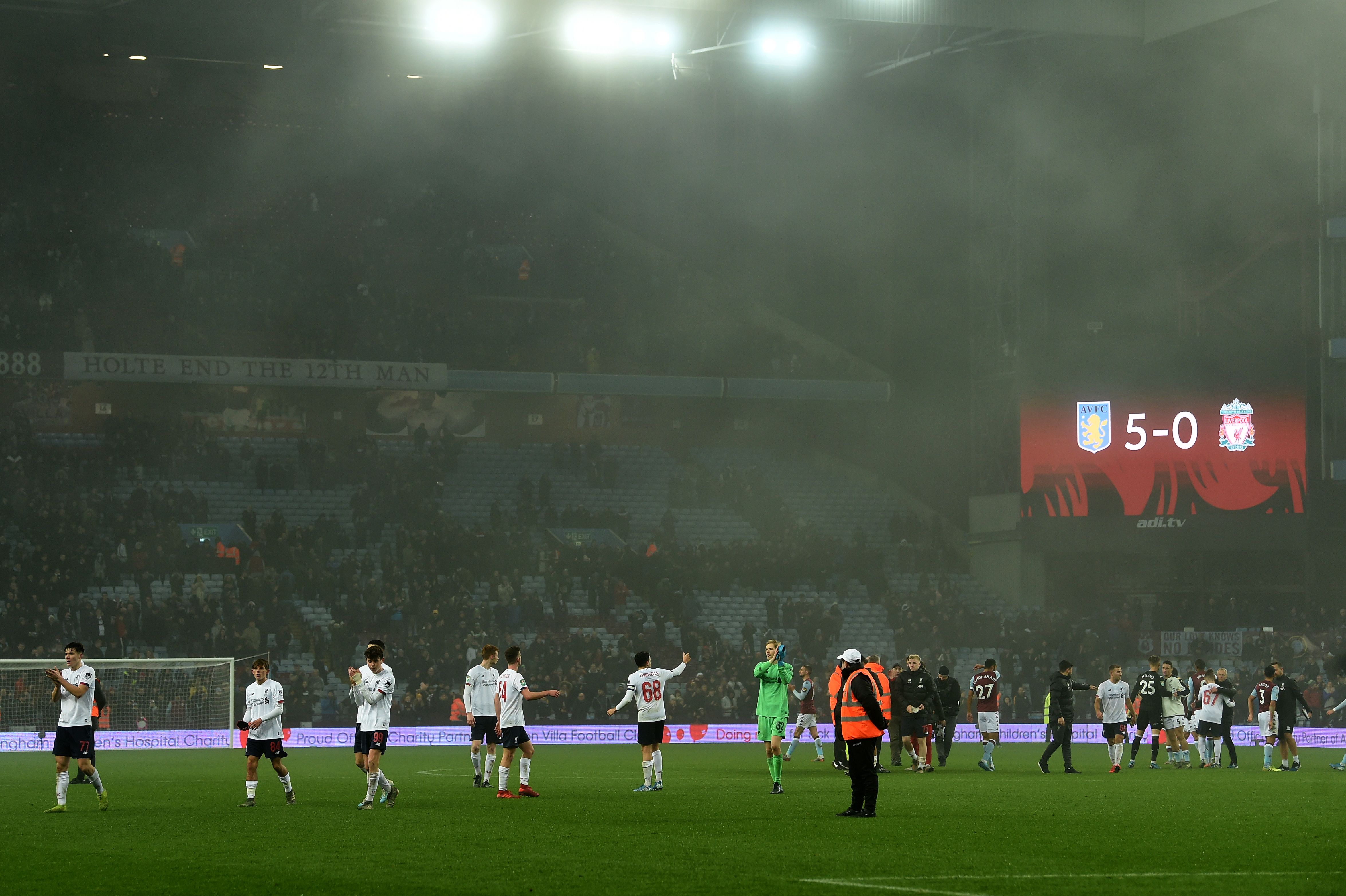 Liverpool players applaud their fans following their 5-0 defeat in the English League Cup quarter-final football match between Aston Villa and Liverpool at Villa Park in Birmingham, central England, on December 17, 2019. - Villa won the match 5-0. (Photo by Paul ELLIS / AFP) / RESTRICTED TO EDITORIAL USE. No use with unauthorized audio, video, data, fixture lists, club/league logos or 'live' services. Online in-match use limited to 120 images. An additional 40 images may be used in extra time. No video emulation. Social media in-match use limited to 120 images. An additional 40 images may be used in extra time. No use in betting publications, games or single club/league/player publications. /  (Photo by PAUL ELLIS/AFP via Getty Images)