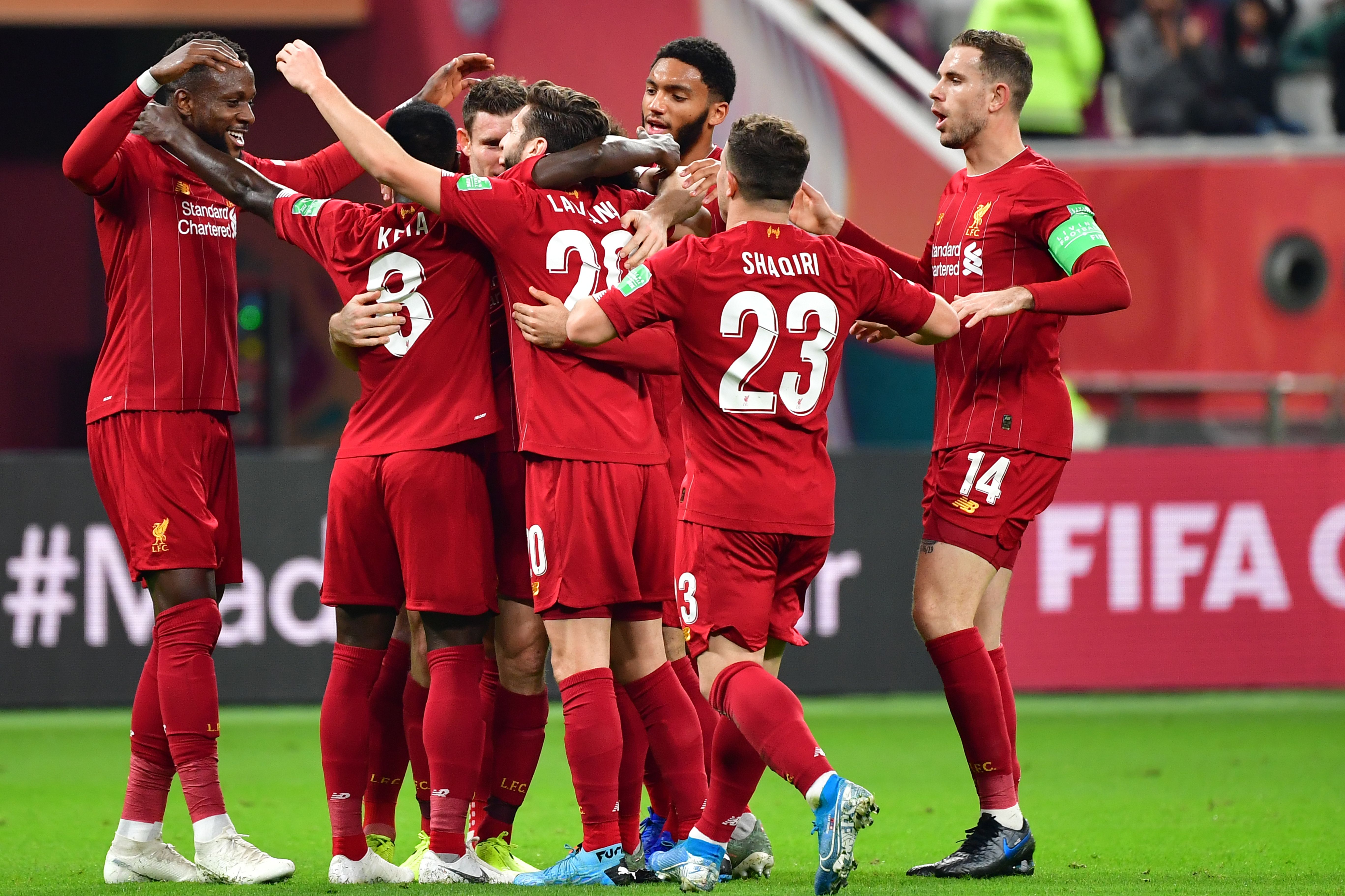 Liverpool's players celebrate their opening goal during the 2019 FIFA Club World Cup semi-final football match between Mexico's Monterrey and England's Liverpool at the Khalifa International Stadium in the Qatari capital Doha on December 18, 2019. (Photo by Giuseppe CACACE / AFP) (Photo by GIUSEPPE CACACE/AFP via Getty Images)