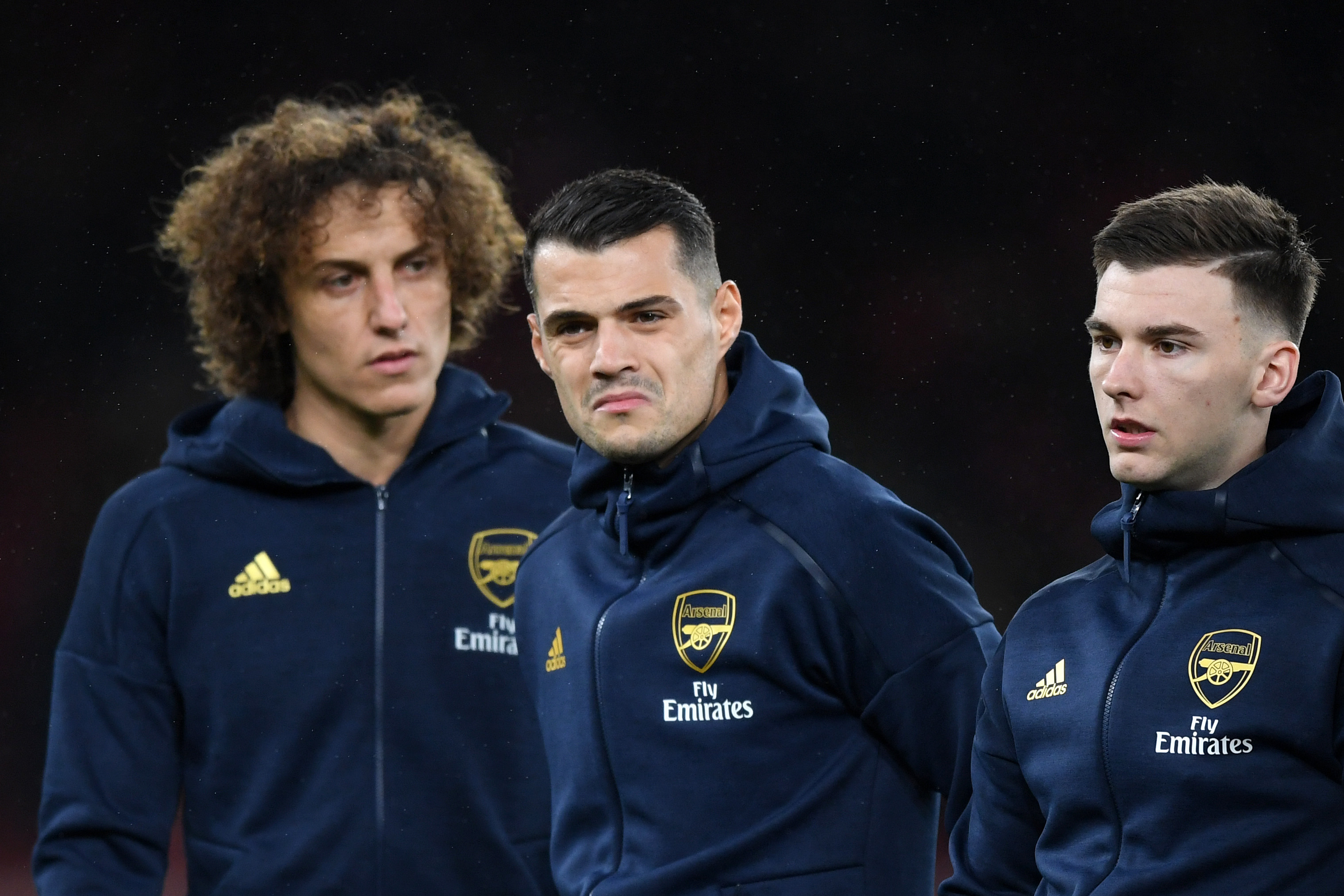 LONDON, ENGLAND - NOVEMBER 28: (L-R) David Luiz, Granit Xhaka and Kieran Tierney of Arsenal look on they line up ahead of the UEFA Europa League group F match between Arsenal FC and Eintracht Frankfurt at Emirates Stadium on November 28, 2019 in London, United Kingdom. (Photo by Shaun Botterill/Getty Images)