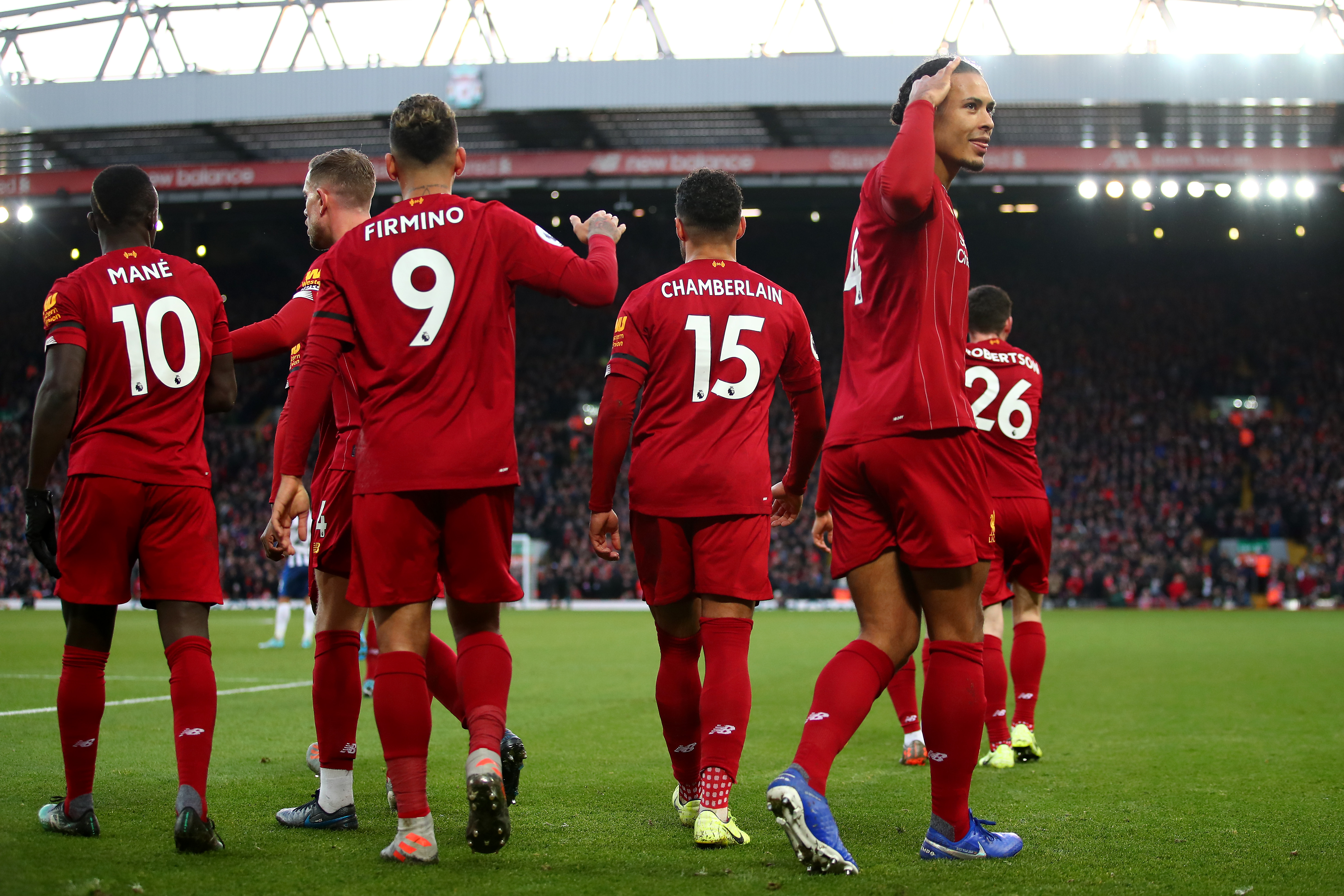 LIVERPOOL, ENGLAND - NOVEMBER 30: Virgil van Dijk of Liverpool celebrates scoring his teams second goal with team mates during the Premier League match between Liverpool FC and Brighton & Hove Albion at Anfield on November 30, 2019 in Liverpool, United Kingdom. (Photo by Clive Brunskill/Getty Images)