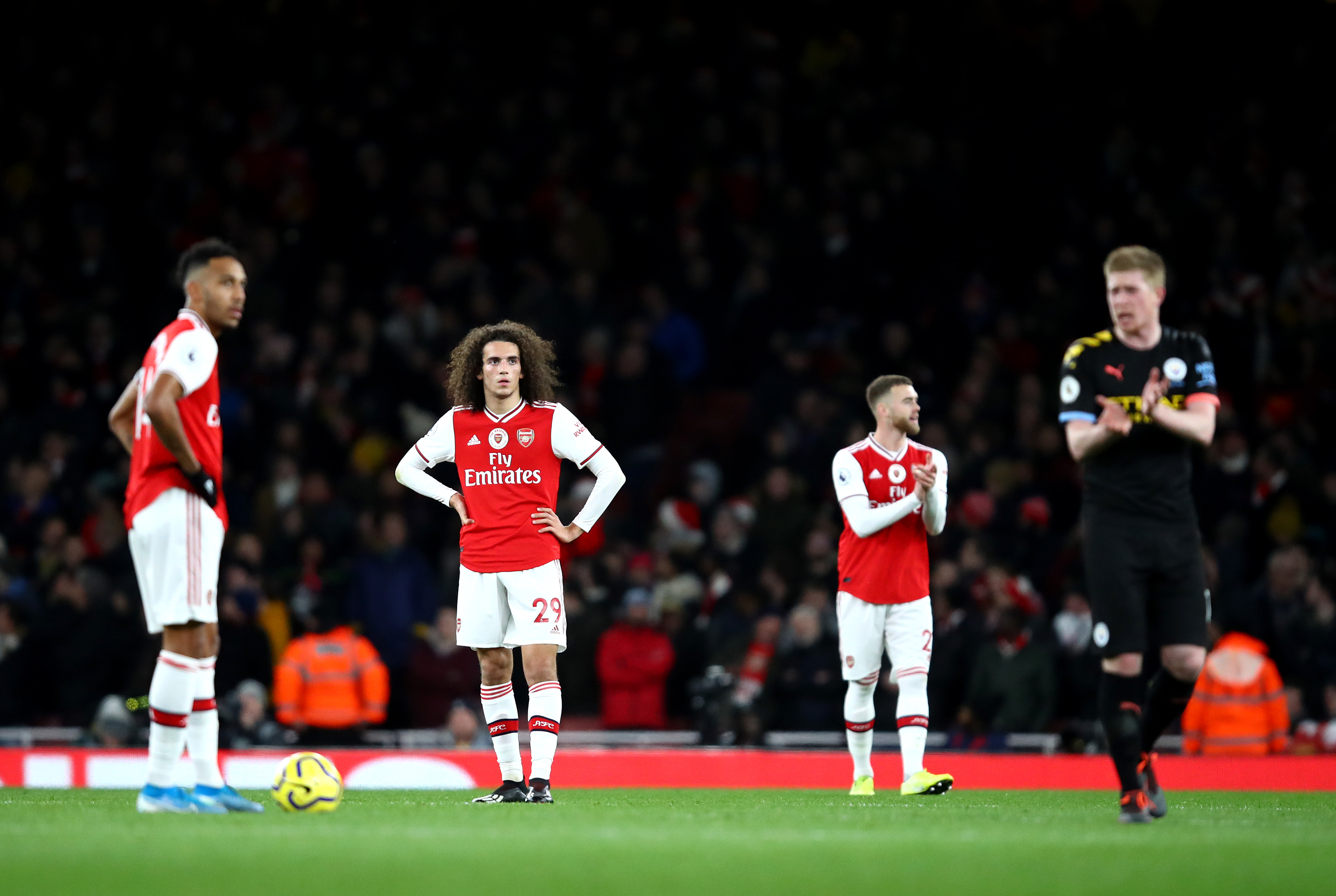 LONDON, ENGLAND - DECEMBER 15: Matteo Guendouzi of Arsenal  reacts to Manchester City scoring there third goal during the Premier League match between Arsenal FC and Manchester City at Emirates Stadium on December 15, 2019 in London, United Kingdom. (Photo by Julian Finney/Getty Images)