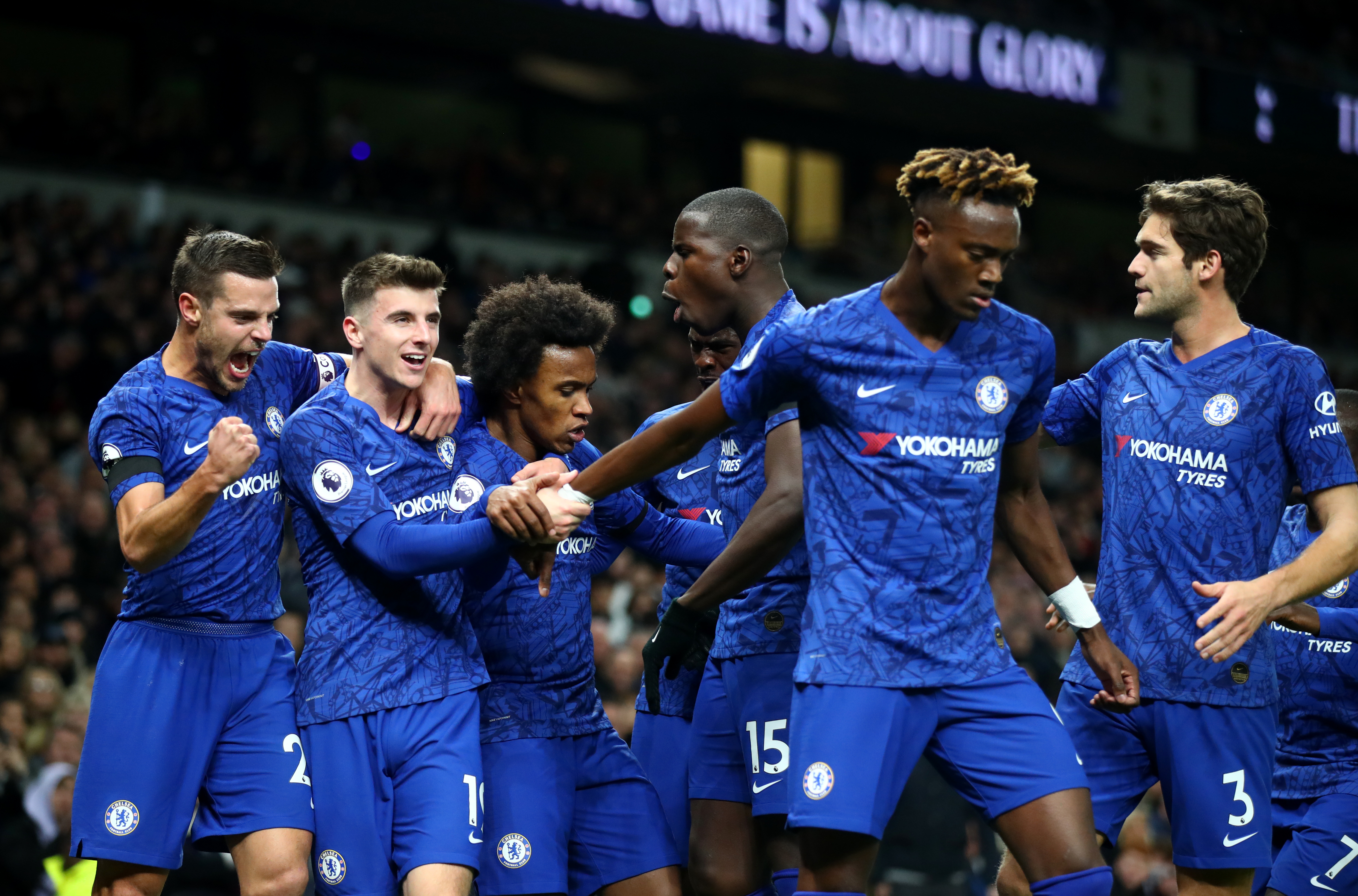 LONDON, ENGLAND - DECEMBER 22: Willian of Chelsea celebrates after scoring his sides first goal with team mates  during the Premier League match between Tottenham Hotspur and Chelsea FC at Tottenham Hotspur Stadium on December 22, 2019 in London, United Kingdom. (Photo by Julian Finney/Getty Images)