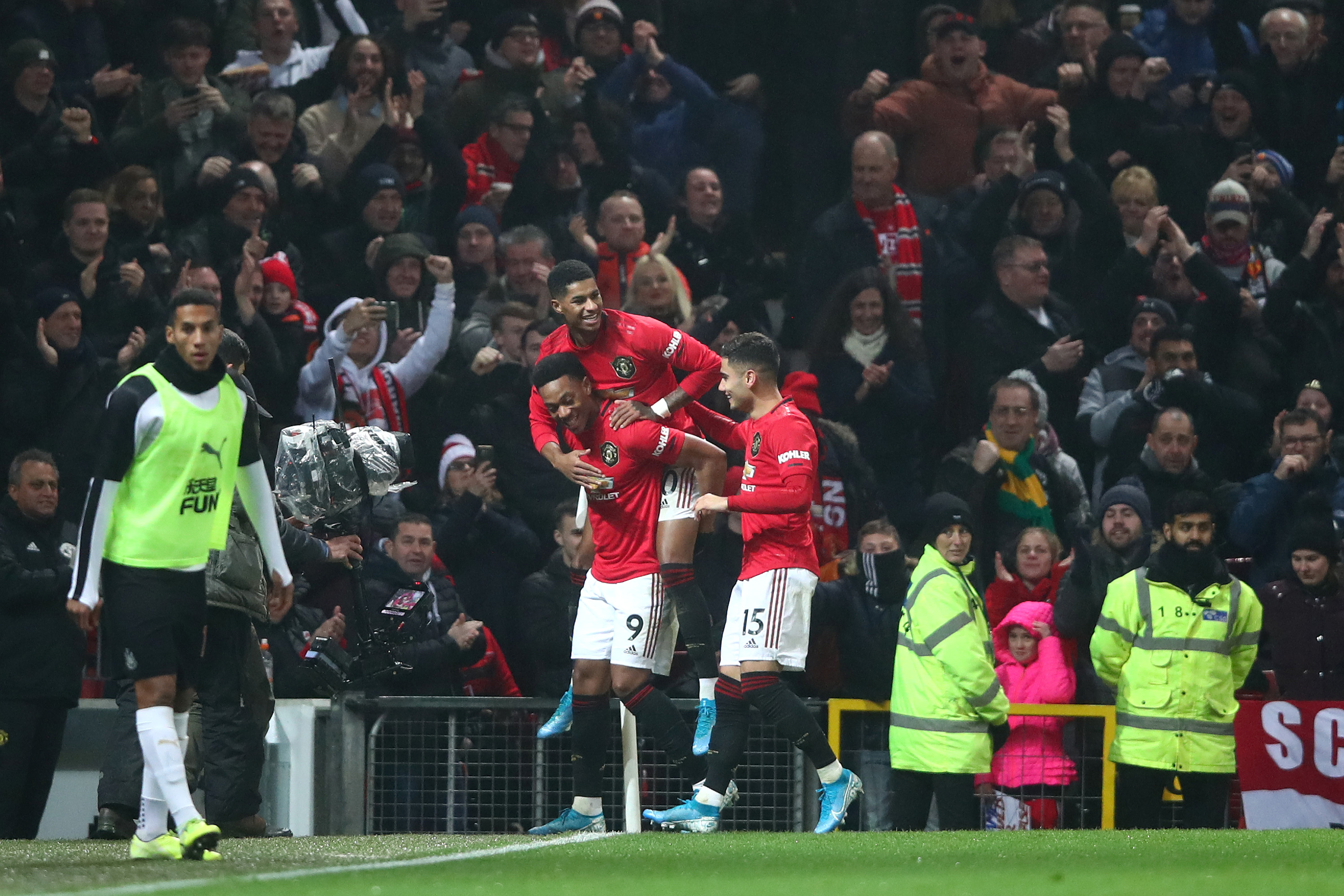 MANCHESTER, ENGLAND - DECEMBER 26: Anthony Martial of Manchester United celebrates with teammates after scoring his team's fourth goal during the Premier League match between Manchester United and Newcastle United at Old Trafford on December 26, 2019 in Manchester, United Kingdom. (Photo by Clive Brunskill/Getty Images)