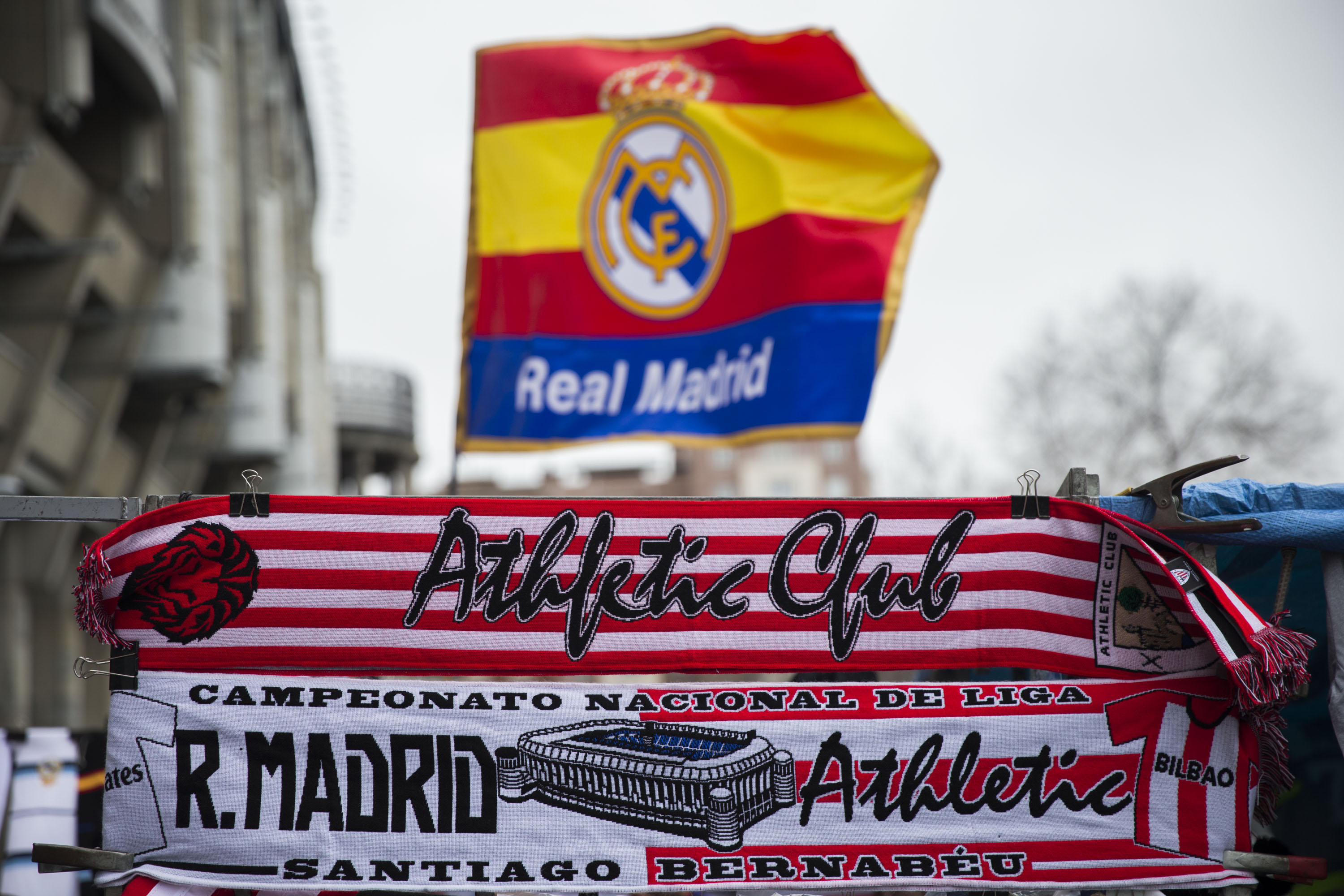 MADRID, SPAIN - FEBRUARY 13: The match scarf is displayed behind an Athletic Club one at a merchandaising stall before  the La Liga match between Real Madrid CF and Athletic Club at Estadio Santiago Bernabeu outdoors on February 13, 2016 in Madrid, Spain.  (Photo by Gonzalo Arroyo Moreno/Getty Images)