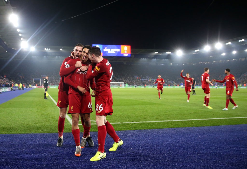 LEICESTER, ENGLAND - DECEMBER 26: Trent Alexander-Arnold of Liverpool celebrates scoring his sides fourth goal with Jordan Henderson and Andy Robertson during the Premier League match between Leicester City and Liverpool FC at The King Power Stadium on December 26, 2019 in Leicester, United Kingdom. (Photo by Alex Pantling/Getty Images)