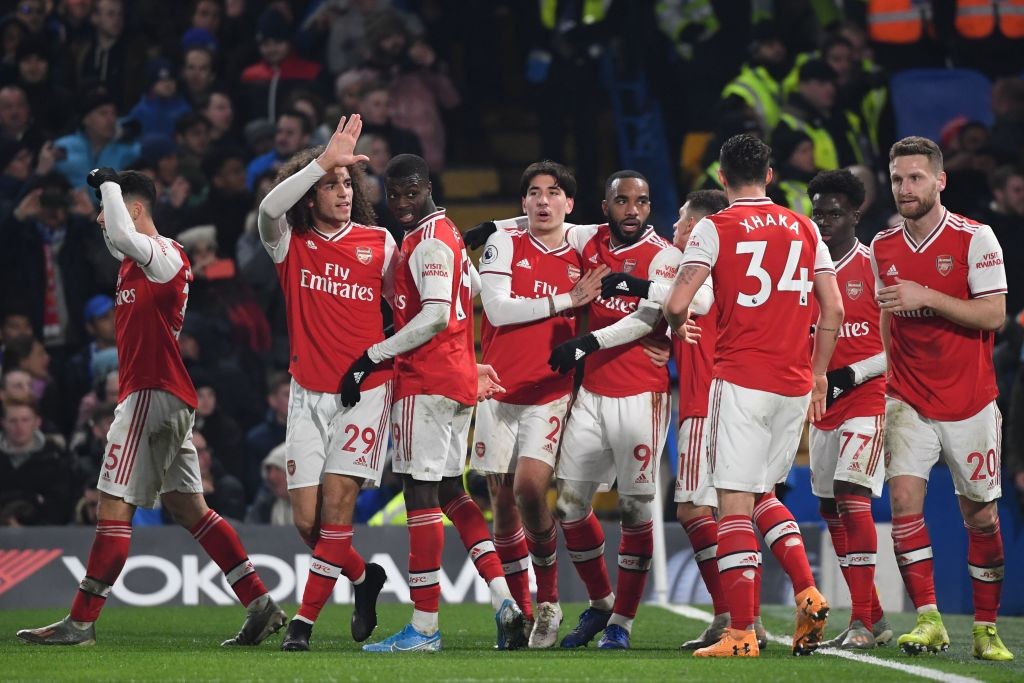 Arsenal players celebrate after Arsenal's Brazilian striker Gabriel Martinelli (L) scored their first goal to equalise 1-1 during the English Premier League football match between Chelsea and Arsenal at Stamford Bridge in London on January 21, 2020. (Photo by DANIEL LEAL-OLIVAS / AFP) / RESTRICTED TO EDITORIAL USE. No use with unauthorized audio, video, data, fixture lists, club/league logos or 'live' services. Online in-match use limited to 120 images. An additional 40 images may be used in extra time. No video emulation. Social media in-match use limited to 120 images. An additional 40 images may be used in extra time. No use in betting publications, games or single club/league/player publications. / (Photo by DANIEL LEAL-OLIVAS/AFP via Getty Images)