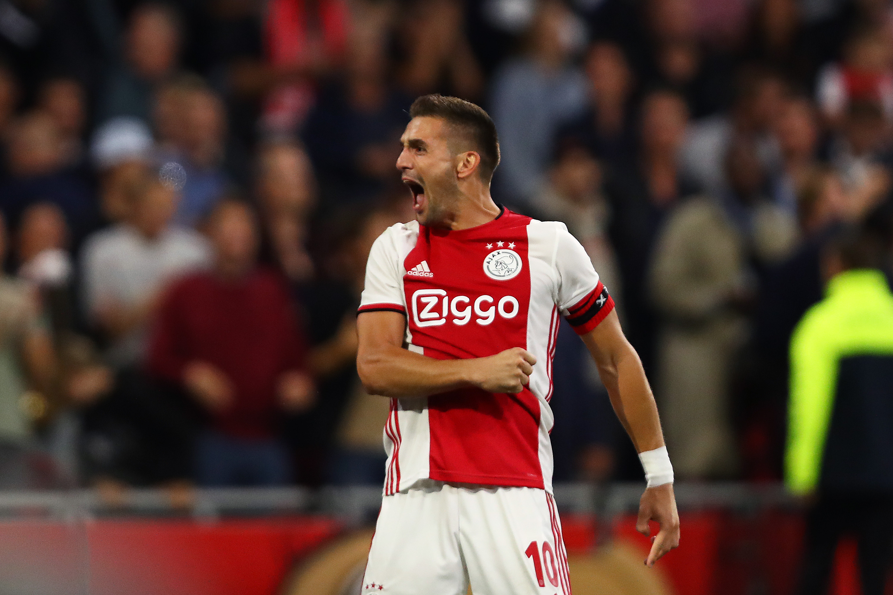 AMSTERDAM, NETHERLANDS - AUGUST 13: Dusan Tadic of Ajax celebrates scoring his sides third goal during the UEFA Champions League Third Qualifying Round match between Ajax and PAOK Saloniki at Johan Cruyff Arena on August 13, 2019 in Amsterdam, Netherlands. (Photo by Dean Mouhtaropoulos/Getty Images)