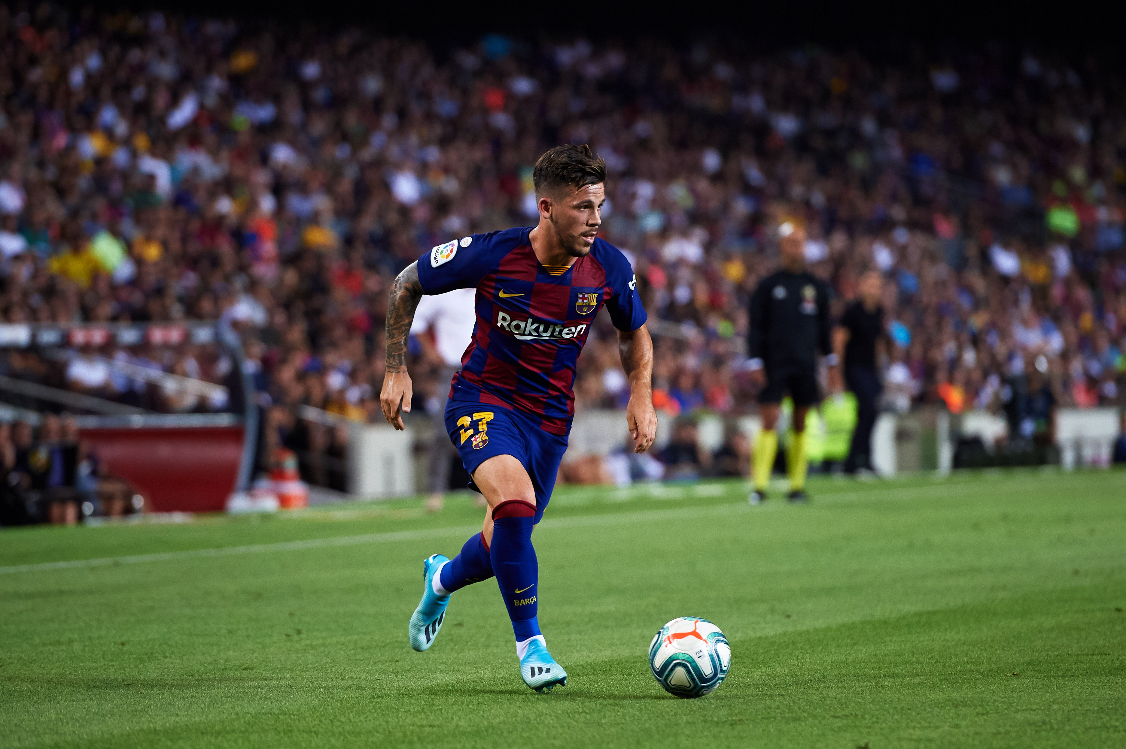 BARCELONA, SPAIN - AUGUST 25: Carles Perez of FC Barcelona runs with the ball during the Liga match between FC Barcelona and Real Betis Balompie at Camp Nou on August 25, 2019 in Barcelona, Spain. (Photo by Alex Caparros/Getty Images)