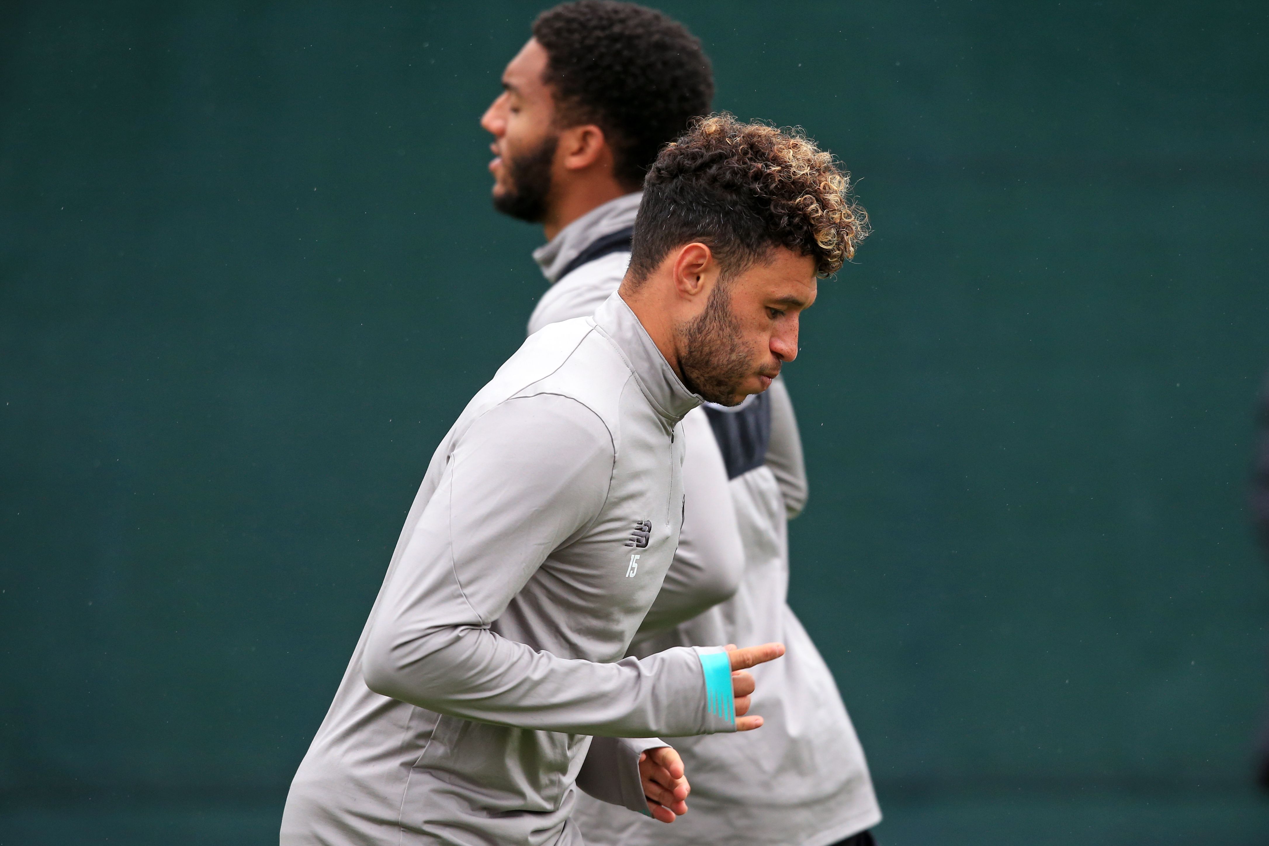 Liverpool's English defender Joe Gomez (L) and Liverpool's English midfielder Alex Oxlade-Chamberlain (R) attend a team training session at Melwood in Liverpool, north west England on October 1, 2019, on the eve of their UEFA Champions League Group E football match against FC Salzburg. (Photo by Lindsey Parnaby / AFP)        (Photo credit should read LINDSEY PARNABY/AFP via Getty Images)