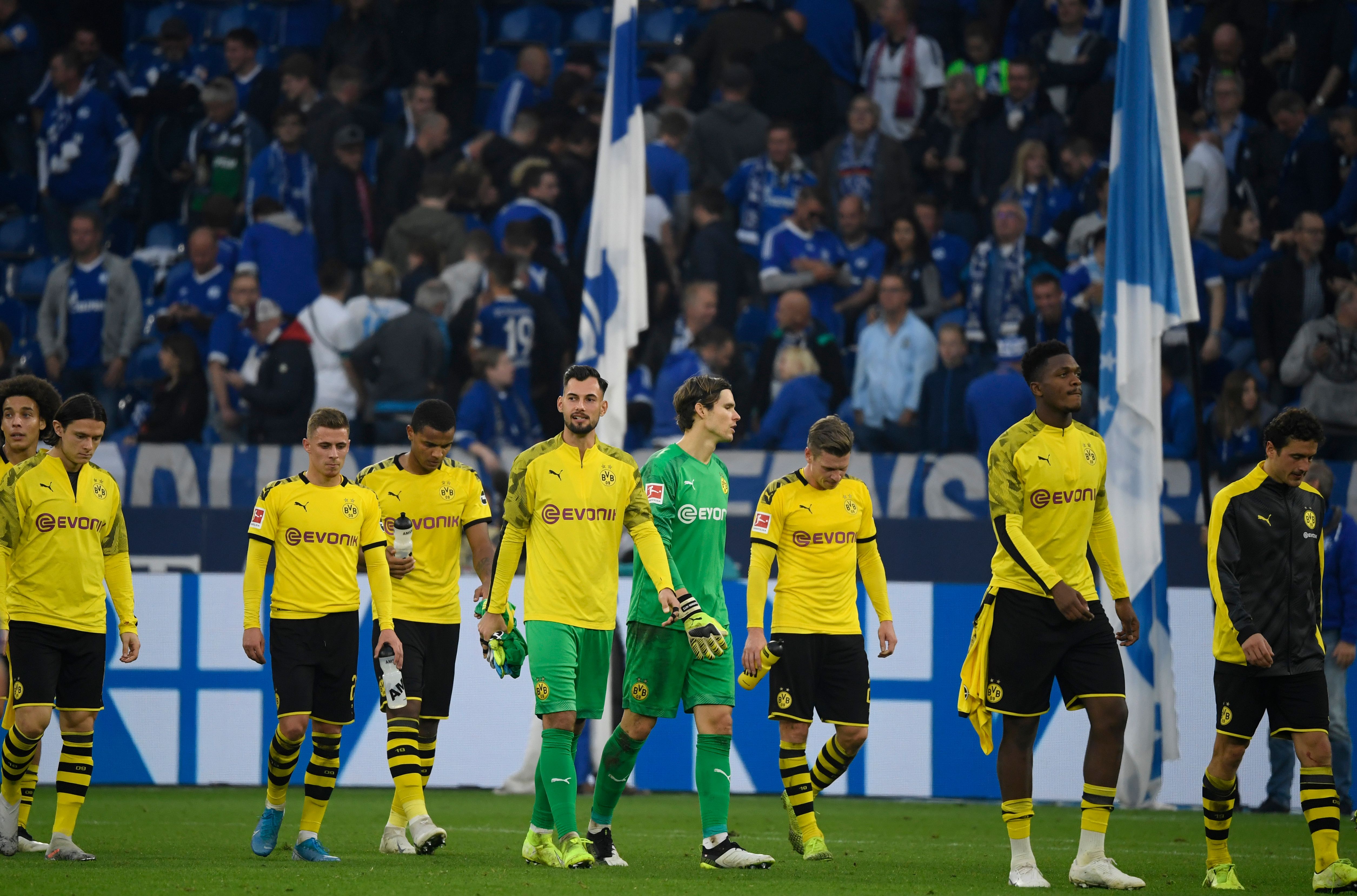 Dortmund's players react the German First division Bundesliga football match between Schalke 04 and Borussia Dortmund in Gelsenkirchen, on October 26, 2019. (Photo by INA FASSBENDER / AFP) / DFL REGULATIONS PROHIBIT ANY USE OF PHOTOGRAPHS AS IMAGE SEQUENCES AND/OR QUASI-VIDEO (Photo by INA FASSBENDER/AFP via Getty Images)