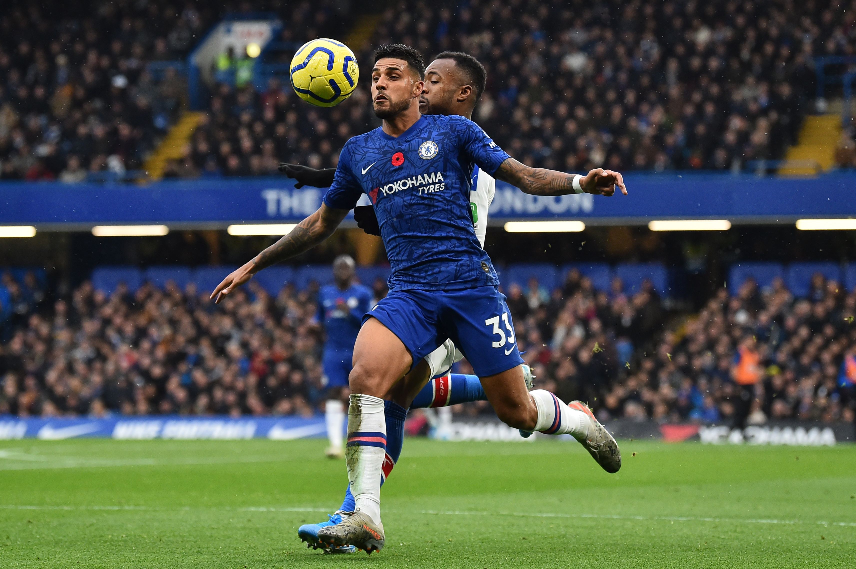 Chelsea's Brazilian-Italian defender Emerson Palmieri (L) vies with Crystal Palace's French-born Ghanaian striker Jordan Ayew during the English Premier League football match between Chelsea and Crystal Palace at Stamford Bridge in London on November 9, 2019. (Photo by Glyn KIRK / AFP) / RESTRICTED TO EDITORIAL USE. No use with unauthorized audio, video, data, fixture lists, club/league logos or 'live' services. Online in-match use limited to 120 images. An additional 40 images may be used in extra time. No video emulation. Social media in-match use limited to 120 images. An additional 40 images may be used in extra time. No use in betting publications, games or single club/league/player publications. /  (Photo by GLYN KIRK/AFP via Getty Images)