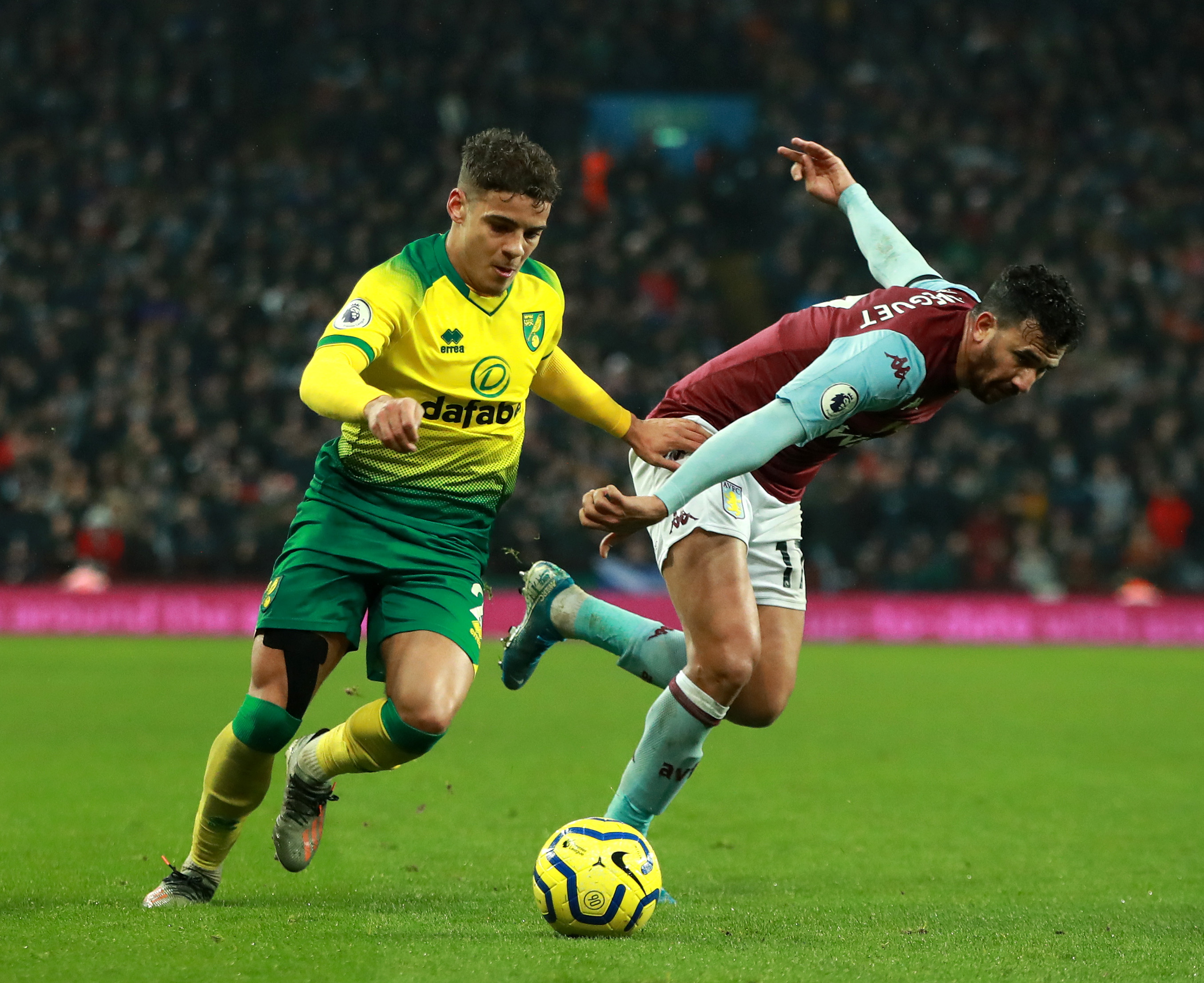 BIRMINGHAM, ENGLAND - DECEMBER 26: Max Aarons of Norwich City takes on Trezeguet during the Premier League match between Aston Villa and Norwich City at Villa Park on December 26, 2019 in Birmingham, United Kingdom. (Photo by David Rogers/Getty Images)