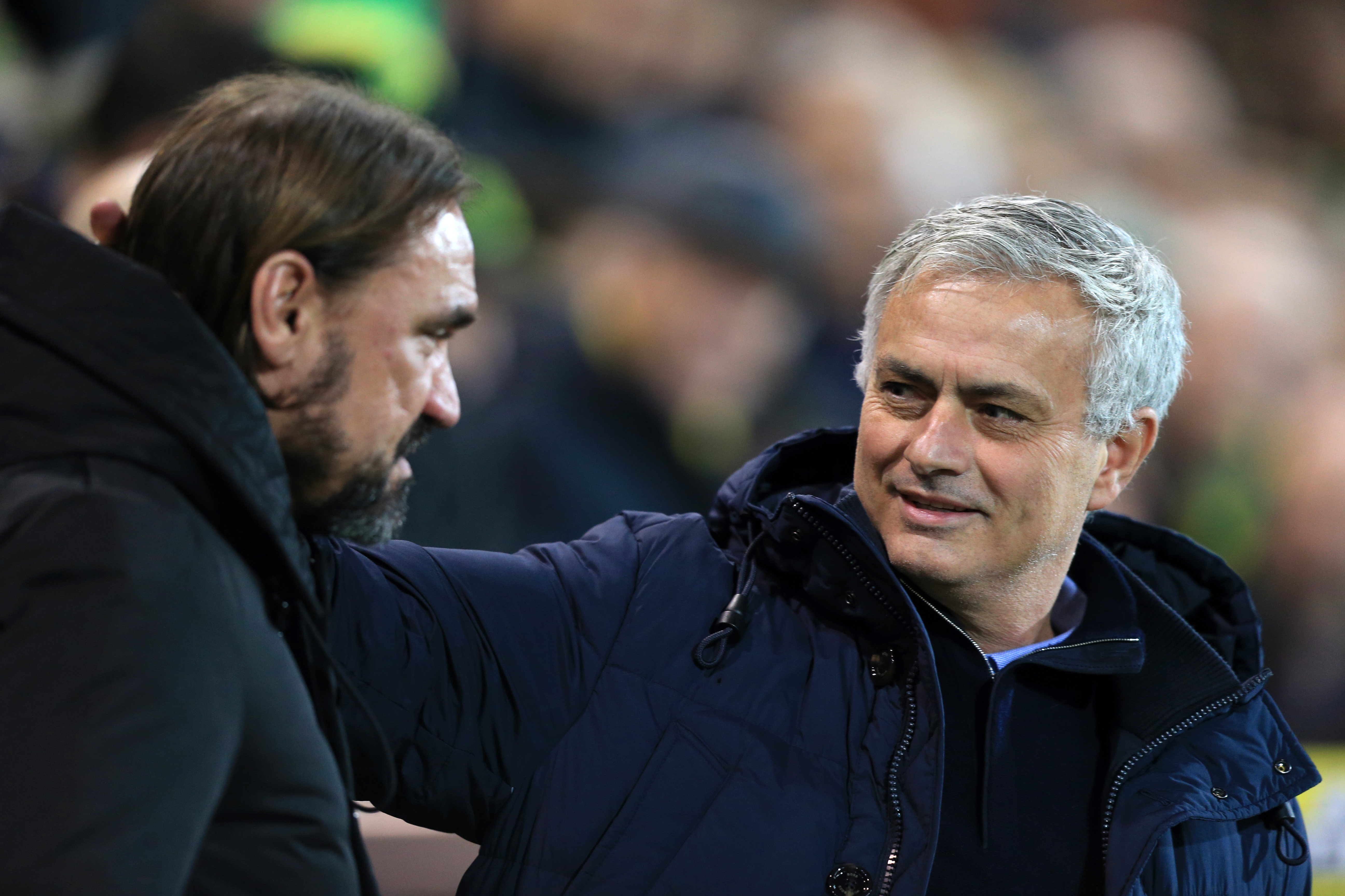 NORWICH, ENGLAND - DECEMBER 28: Jose Mourinho, Manager of Tottenham Hotspur and Daniel Farke, Manager of Norwich City greet each other prior to the Premier League match between Norwich City and Tottenham Hotspur at Carrow Road on December 28, 2019 in Norwich, United Kingdom. (Photo by Stephen Pond/Getty Images)