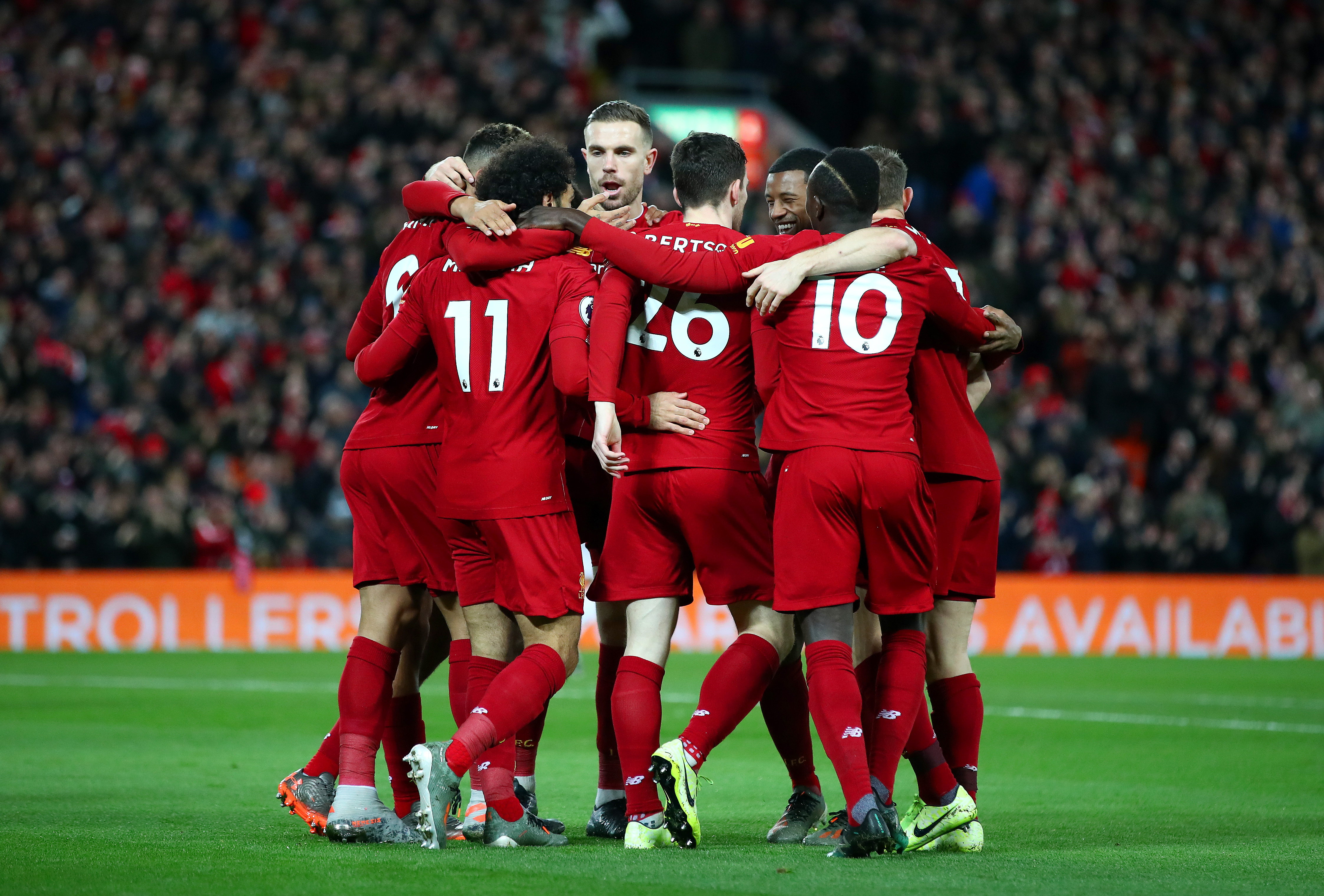 LIVERPOOL, ENGLAND - JANUARY 02: Mohamed Salah of Liverpool celebrates with his team mates after scoring his team's first goal during the Premier League match between Liverpool FC and Sheffield United at Anfield on January 02, 2020 in Liverpool, United Kingdom. (Photo by Clive Brunskill/Getty Images)