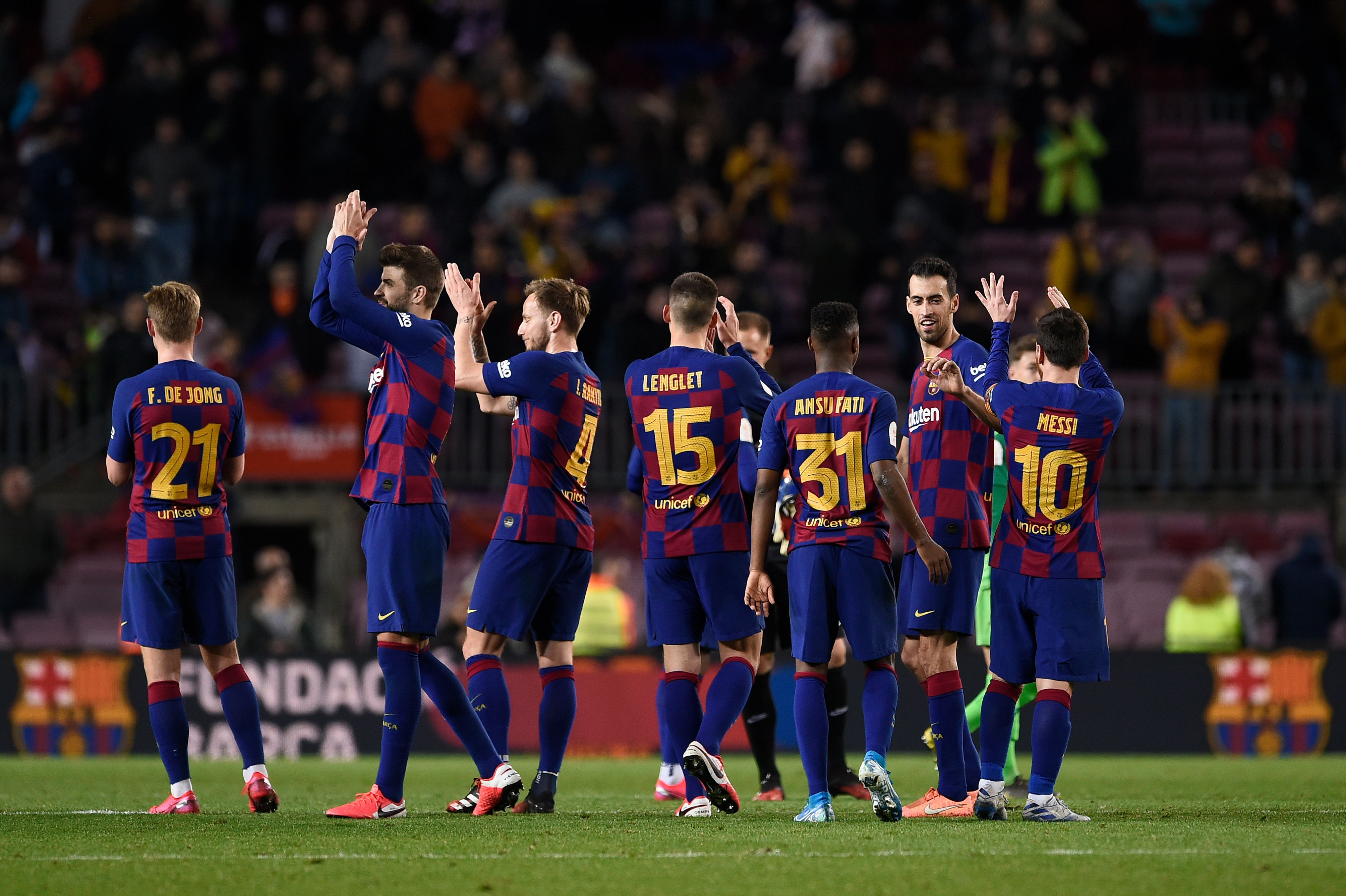 Barcelona players celebrate their win at the end of the Copa del Rey (King's Cup) football match between FC Barcelona and Club Deportivo Leganes SAD at the Camp Nou stadium in Barcelona, on January 30, 2020. (Photo by Josep LAGO / AFP) (Photo by JOSEP LAGO/AFP via Getty Images)