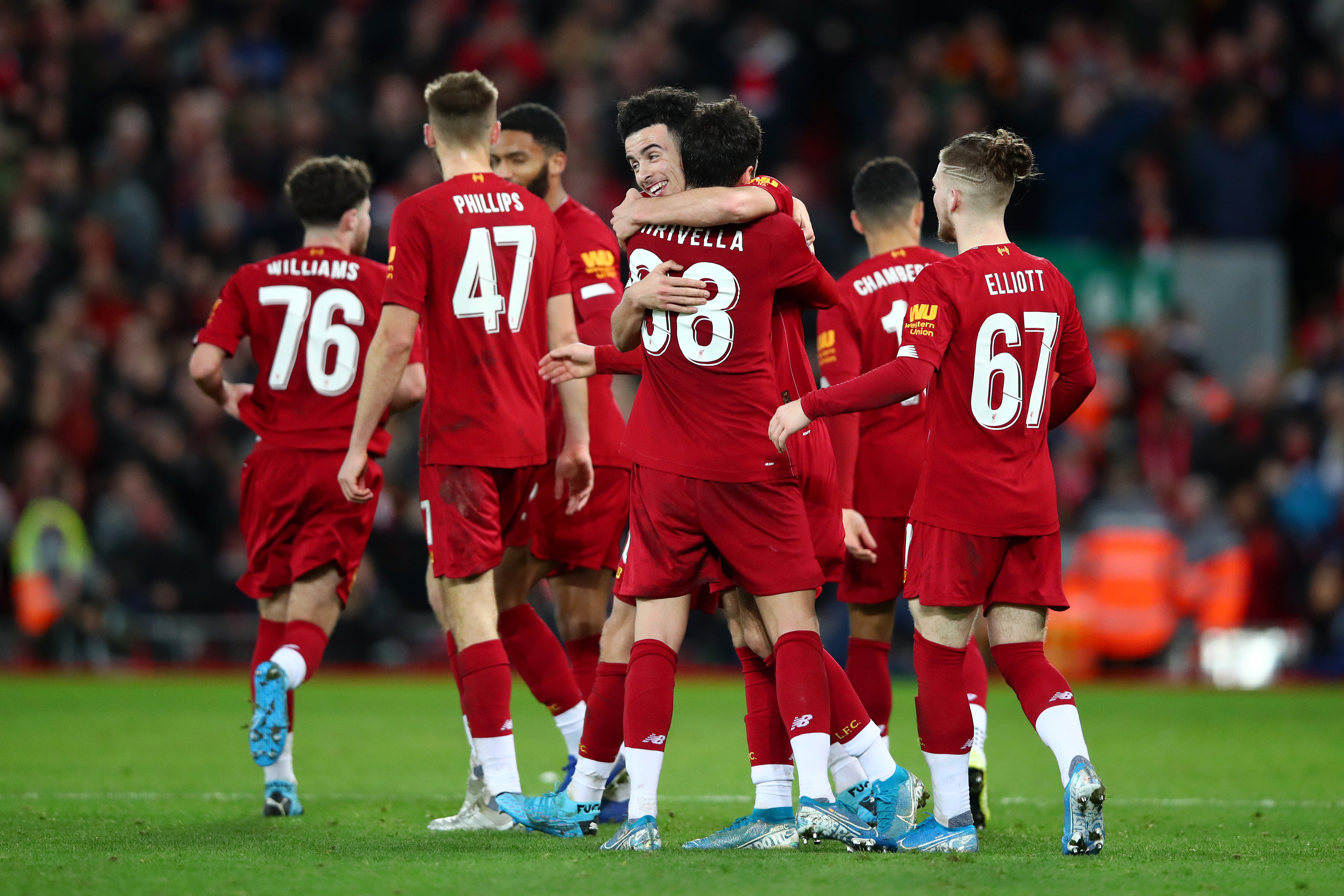 LIVERPOOL, ENGLAND - JANUARY 05: Curtis Jones of Liverpool celebrates with teammates after scoring his team's first goal during the FA Cup Third Round match between Liverpool and Everton at Anfield on January 05, 2020 in Liverpool, England. (Photo by Clive Brunskill/Getty Images)
