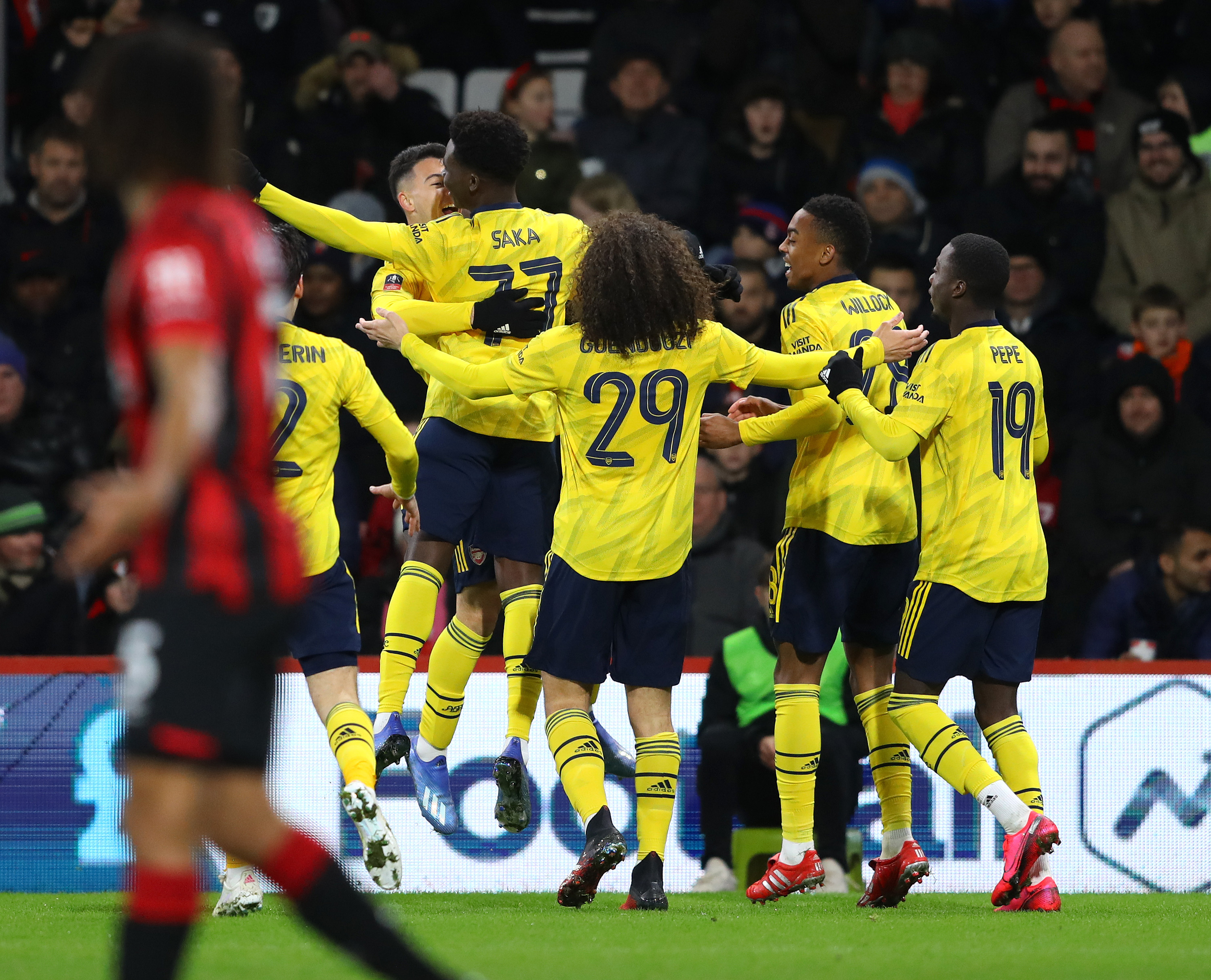 BOURNEMOUTH, ENGLAND - JANUARY 27: Bukayo Saka of Arsenal celebrates with teammates after scoring his team's first goal during the FA Cup Fourth Round match between AFC Bournemouth and Arsenal at Vitality Stadium on January 27, 2020 in Bournemouth, England. (Photo by Warren Little/Getty Images)