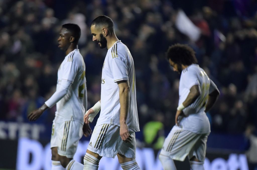 Real Madrid's Brazilian forward Vinicius Junior Real Madrid's French forward Karim Benzema and Real Madrid's Brazilian defender Marcelo react after the Spanish league football match Levante UD against Real Madrid CF at the Ciutat de Valencia stadium in Valencia on February 22, 2020. (Photo by JOSE JORDAN / AFP) (Photo by JOSE JORDAN/AFP via Getty Images)