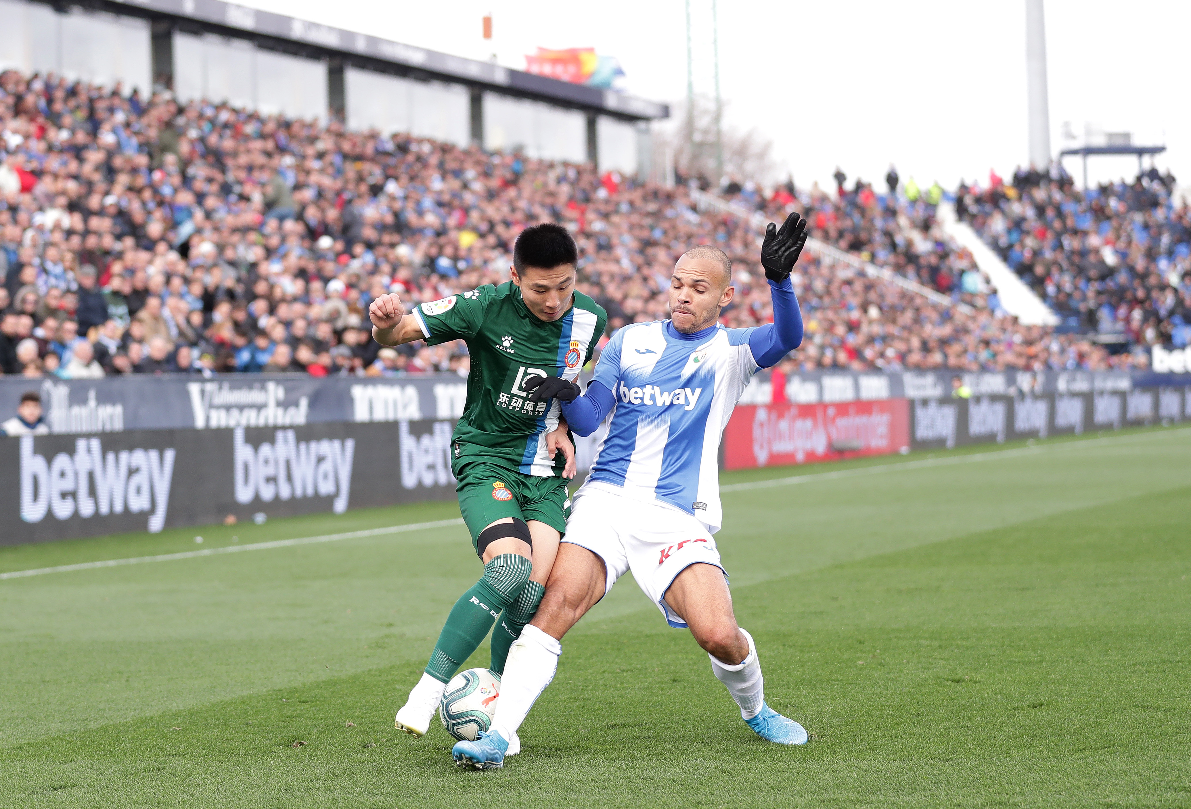 LEGANES, SPAIN - DECEMBER 22: Martin Braithwaite of Leganes and Wu Lei of Espanyol during the Liga match between CD Leganes and RCD Espanyol at Estadio Municipal de Butarque on December 22, 2019 in Leganes, Spain. (Photo by Gonzalo Arroyo Moreno/Getty Images)