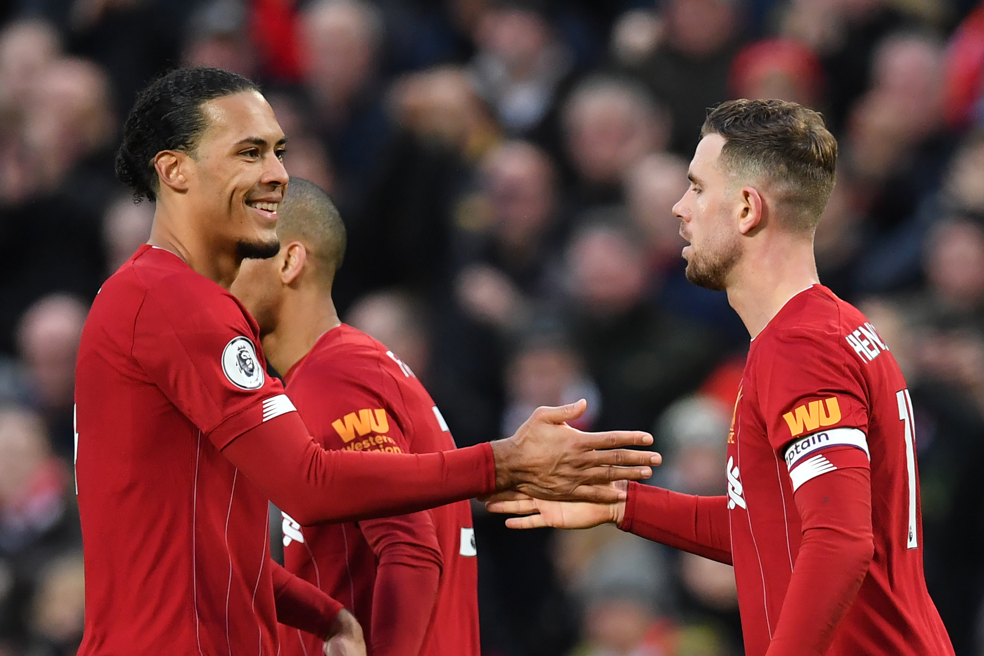 Virgil van Dijk and Jordan Henderson are two of several Liverpool players who miss out against Aston Villa. (Photo by Paul Ellis/AFP via Getty Images)