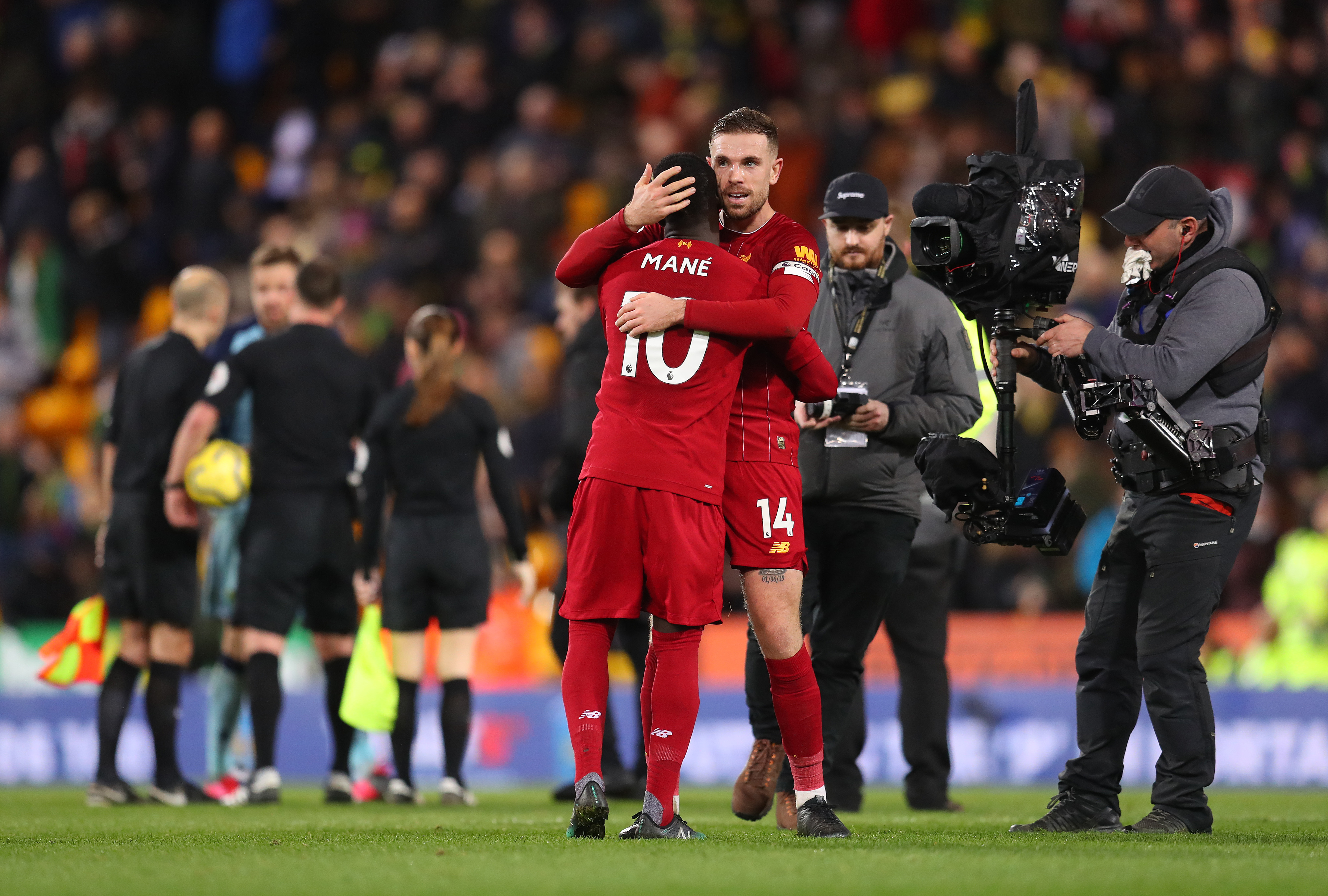 NORWICH, ENGLAND - FEBRUARY 15: Sadio Mane and Jordan Henderson of Liverpool celebrate following their sides victory in the Premier League match between Norwich City and Liverpool FC at Carrow Road on February 15, 2020 in Norwich, United Kingdom. (Photo by Catherine Ivill/Getty Images)